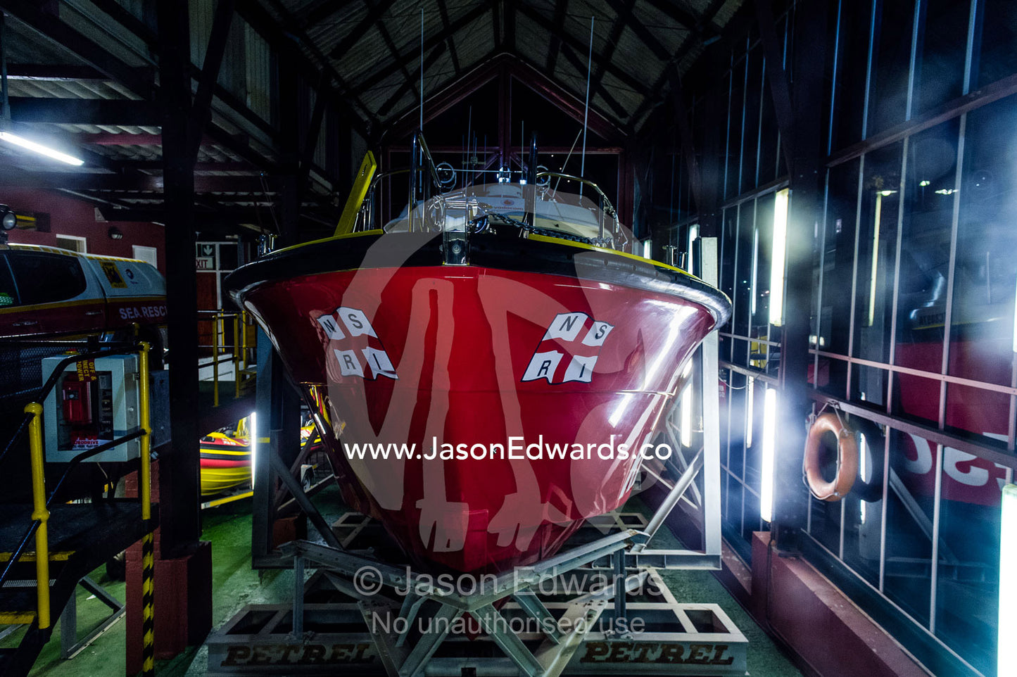 A coastguard rescue boat rests in it's dry-dock awaiting emergencies. Cape Town, Victoria and Alfred Waterfront, Western Cape, South Africa.