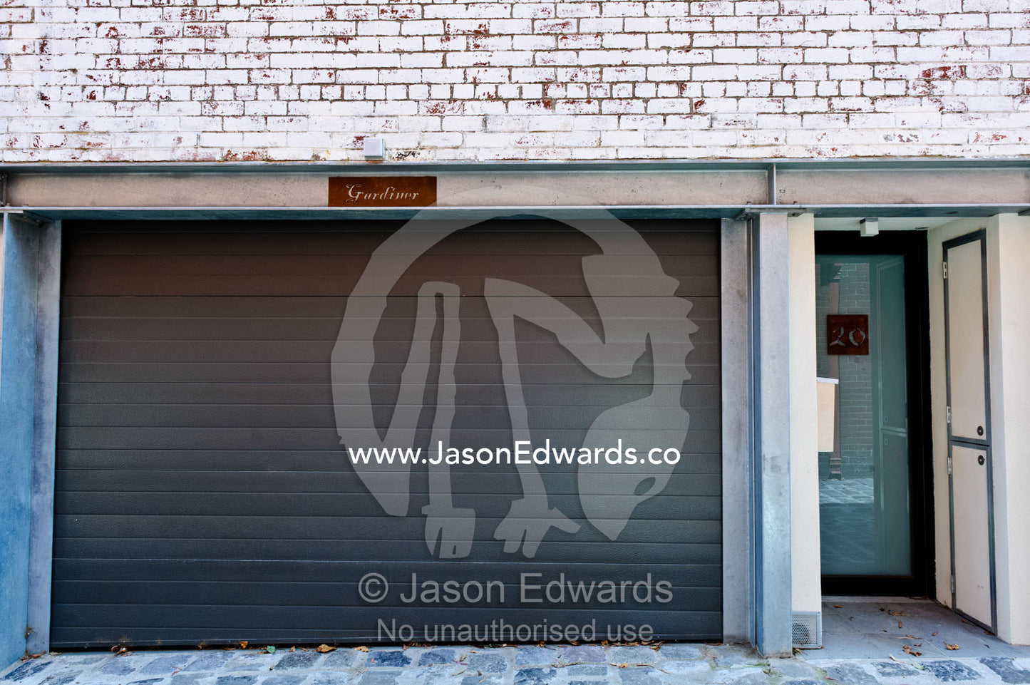 A roller door leads to a garage beneath an inner city apartment. North Melbourne, Melbourne, Victoria, Australia.