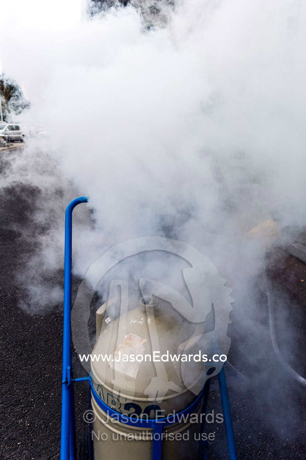 Liquid nitrogen is loaded into a vacuum flask for transportation. Melbourne, Victoria, Australia.