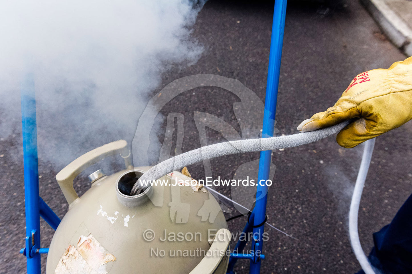 Liquid nitrogen is loaded into a vacuum flask for transportation. Melbourne, Victoria, Australia.