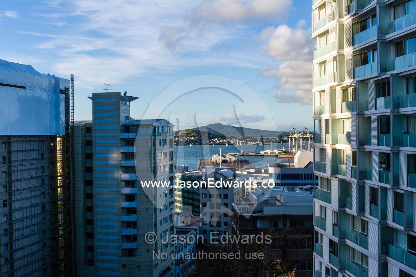 Apartment complexes crowd a waterfront and harbour district. Waterloo Quadrant, Auckland, New Zealand.