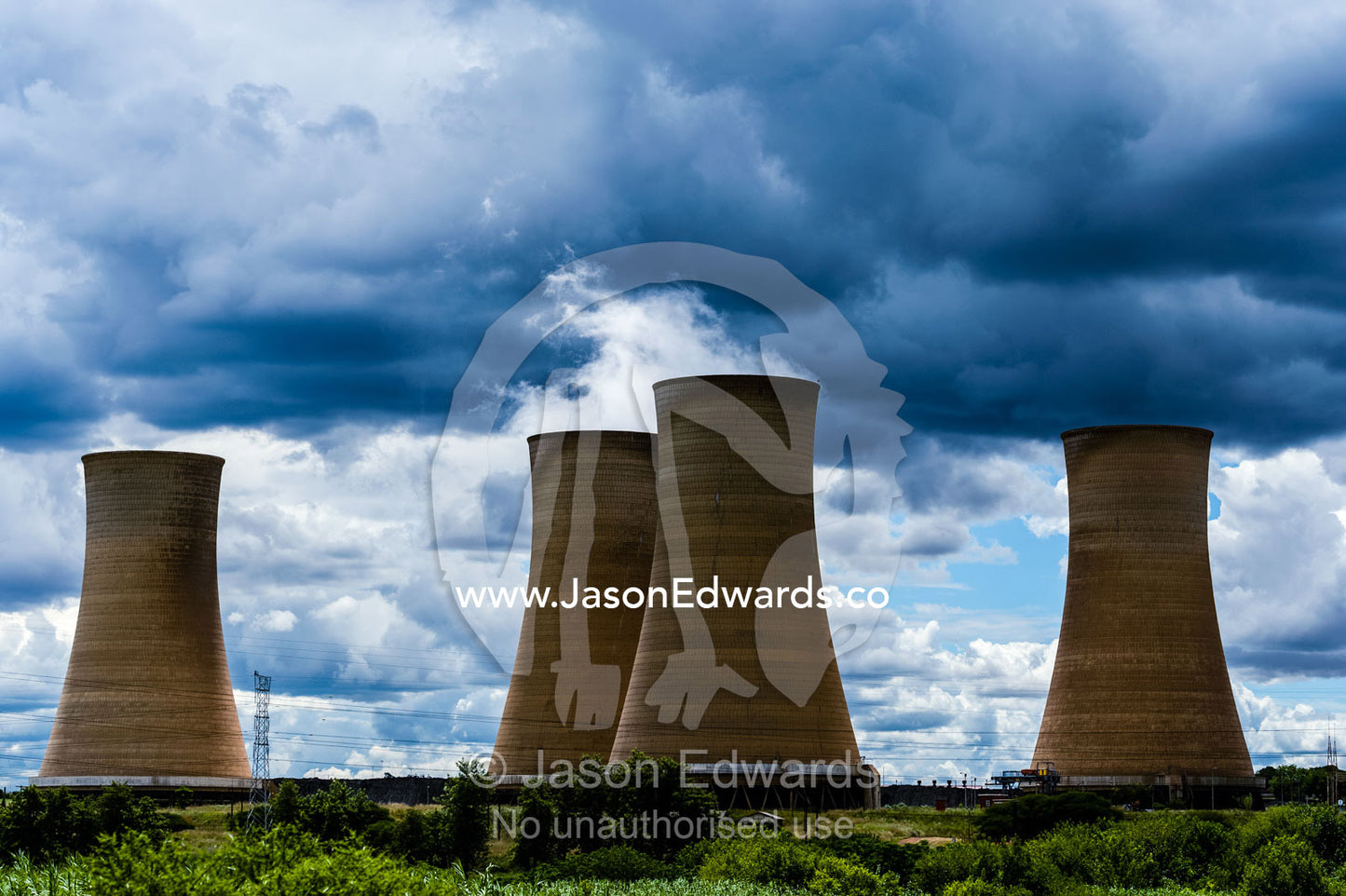 Steam rises from the cooling towers of an electricity power station. Rooiwal, Rooiwal Power Station, Gauteng Province, South Africa.
