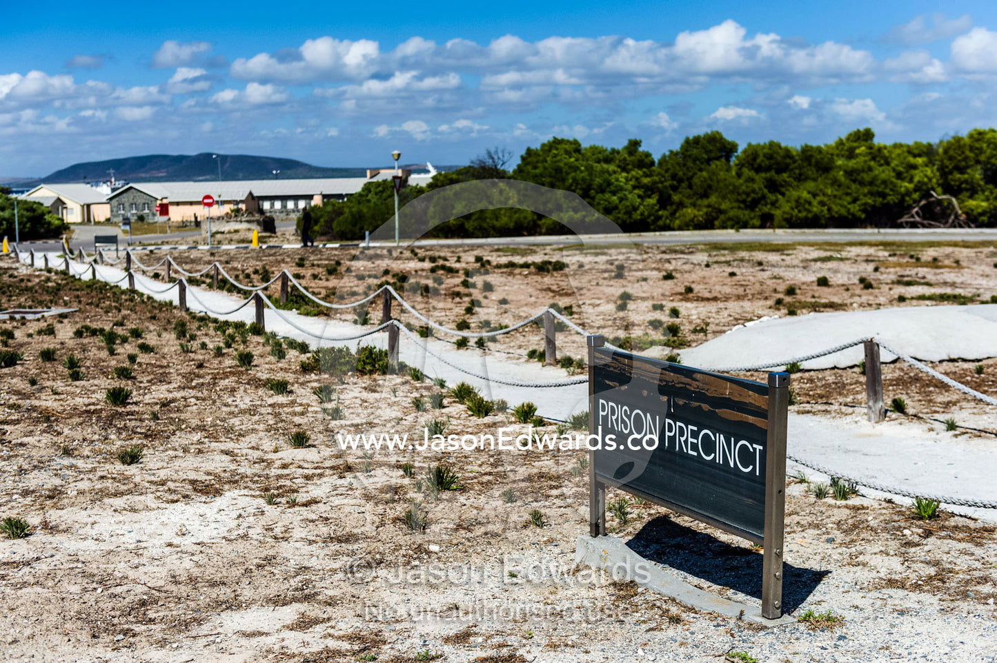 A museum sign indicates the path to the prison precinct. Robben Island, Cape Town, Bloubergstrand, Table Bay, Western Cape, South Africa.