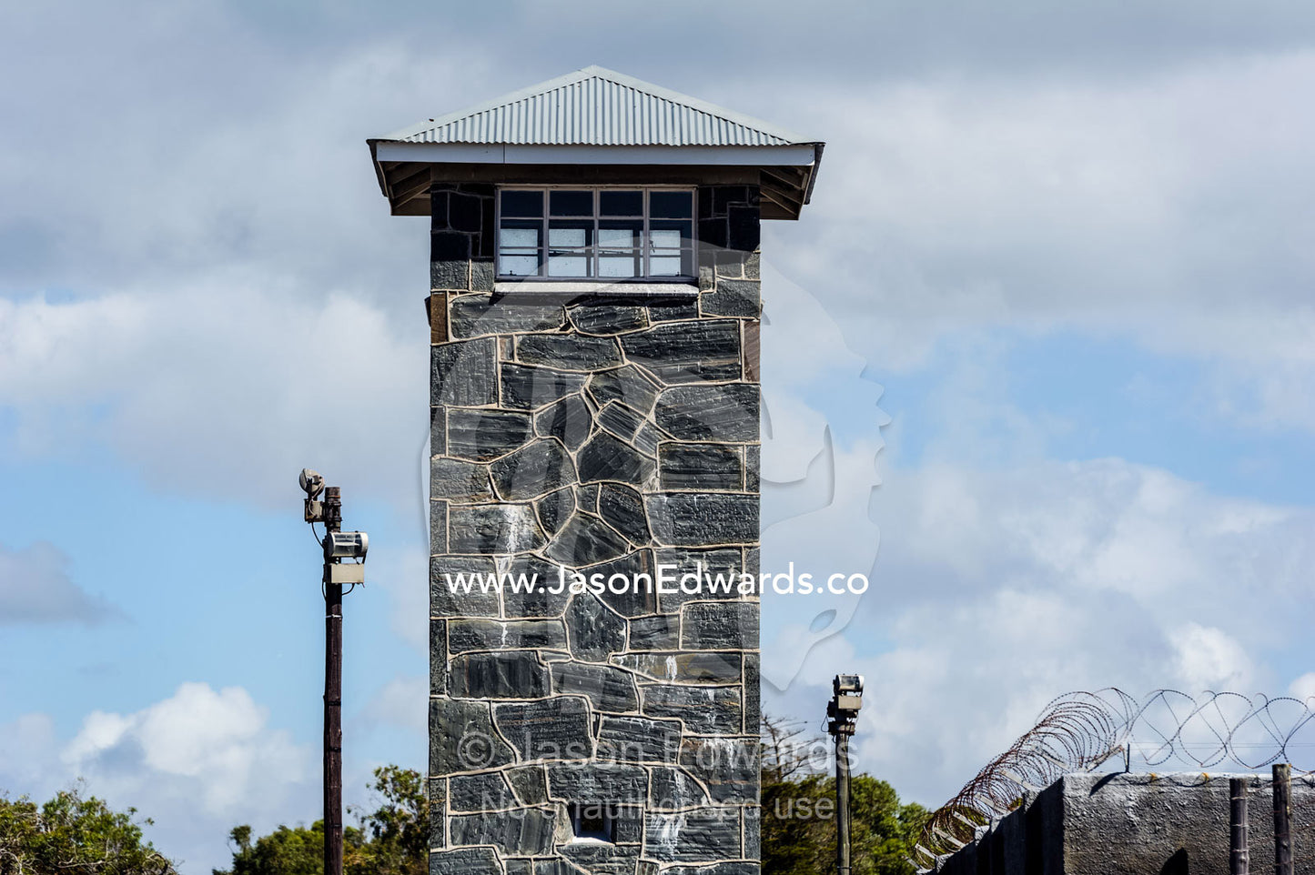 Windows of a guard post look out from a stone prison watch tower. Robben Island, Cape Town, Bloubergstrand, Table Bay, Western Cape, South Africa.