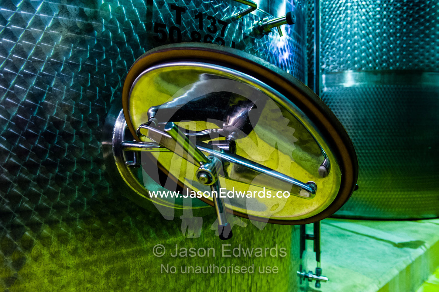 The valve of a sterile stainless steel tank used to ferment the wine. Fairview Wine Estate, Stellenbosch, Western Cape, South Africa.
