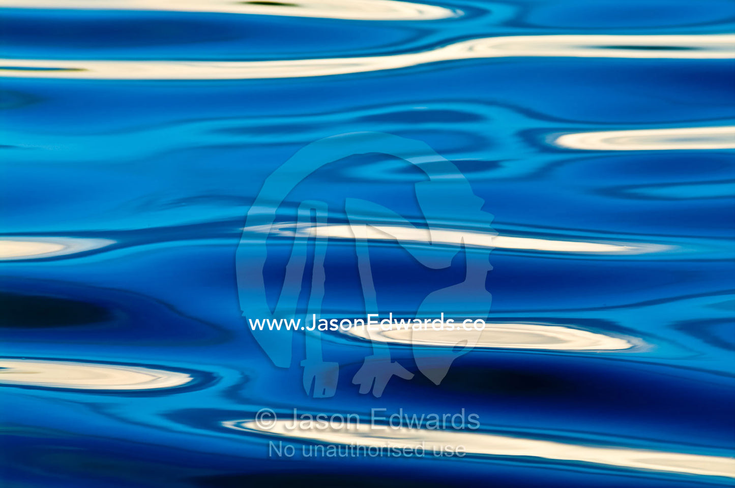 White thunderhead clouds reflected in the surface ripples of a blue lake in the Amazon rainforest. Quistococha Lake, Lago de Quistococha, Parque de Quistococha, Quistococha Zoo, Iquitos, Amazon Basin, Loreto Region, Maynas Province, Peru.