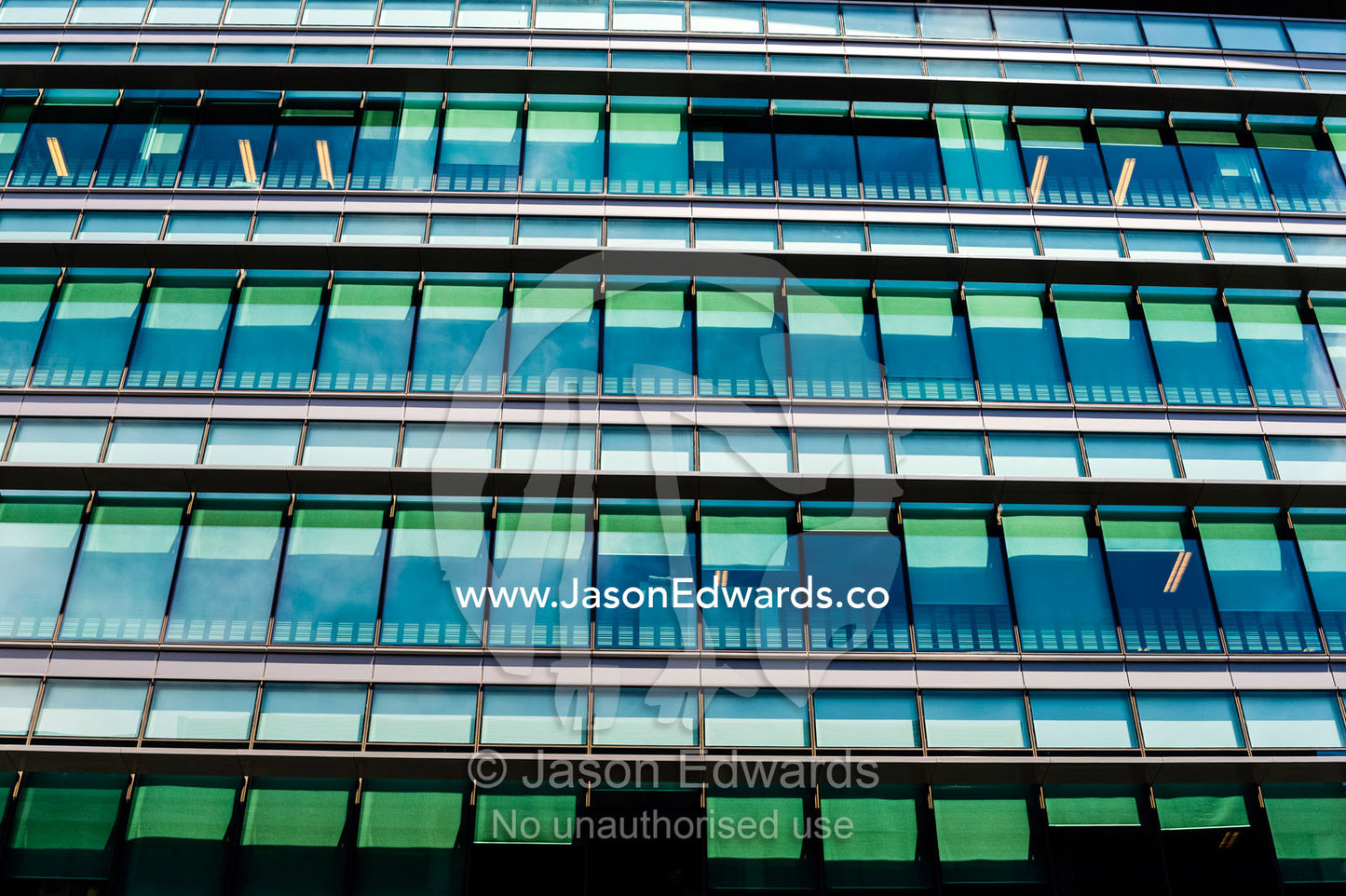 The glass and steel facade of a government corporate office building. Canberra, ACT, Australian Capital Territory, Australia.