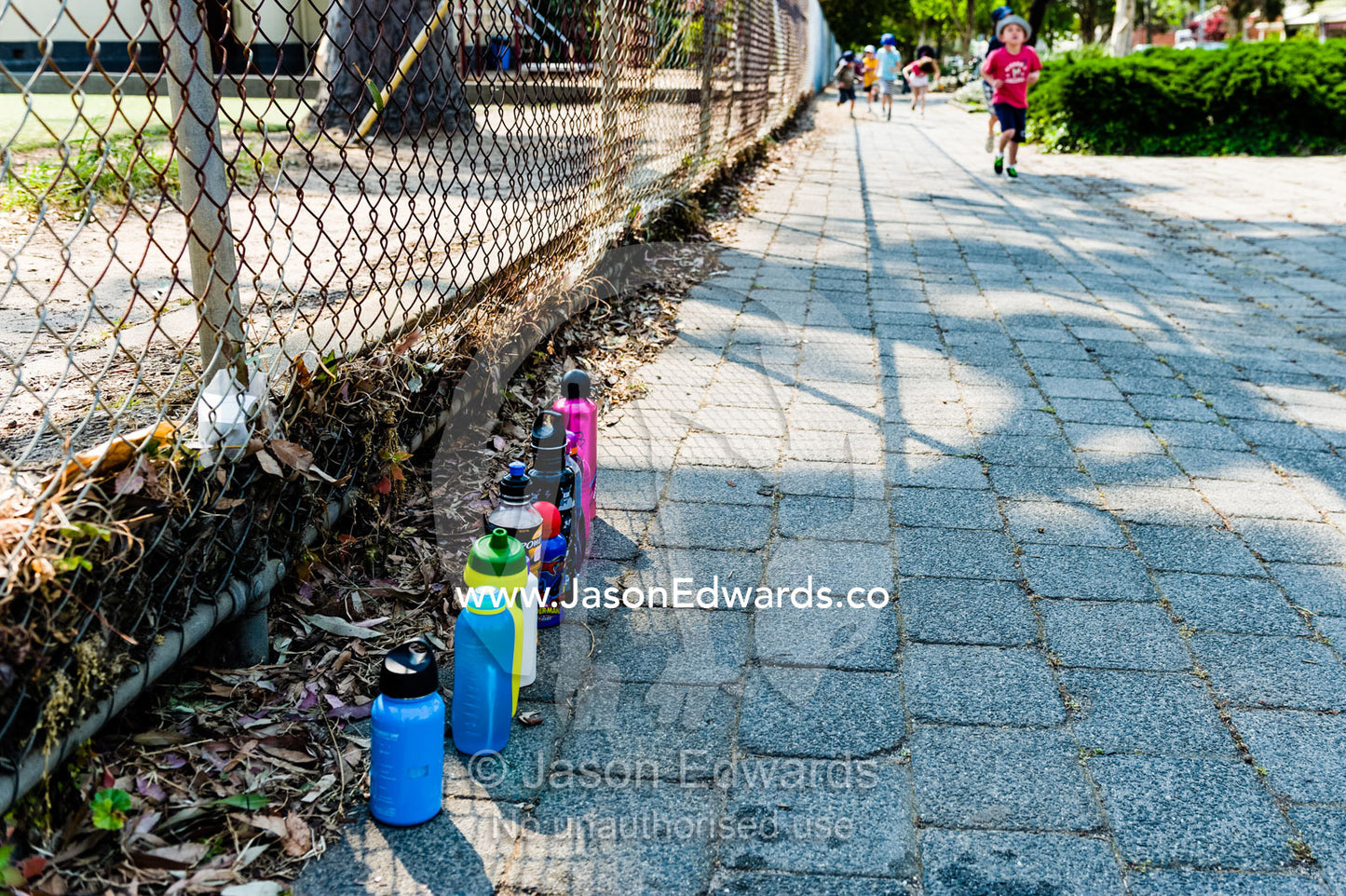 Water bottles for thirsty students at a school walkathon fundraiser. Carlton North Primary School, Carlton North, Melbourne, Victoria, Australia.