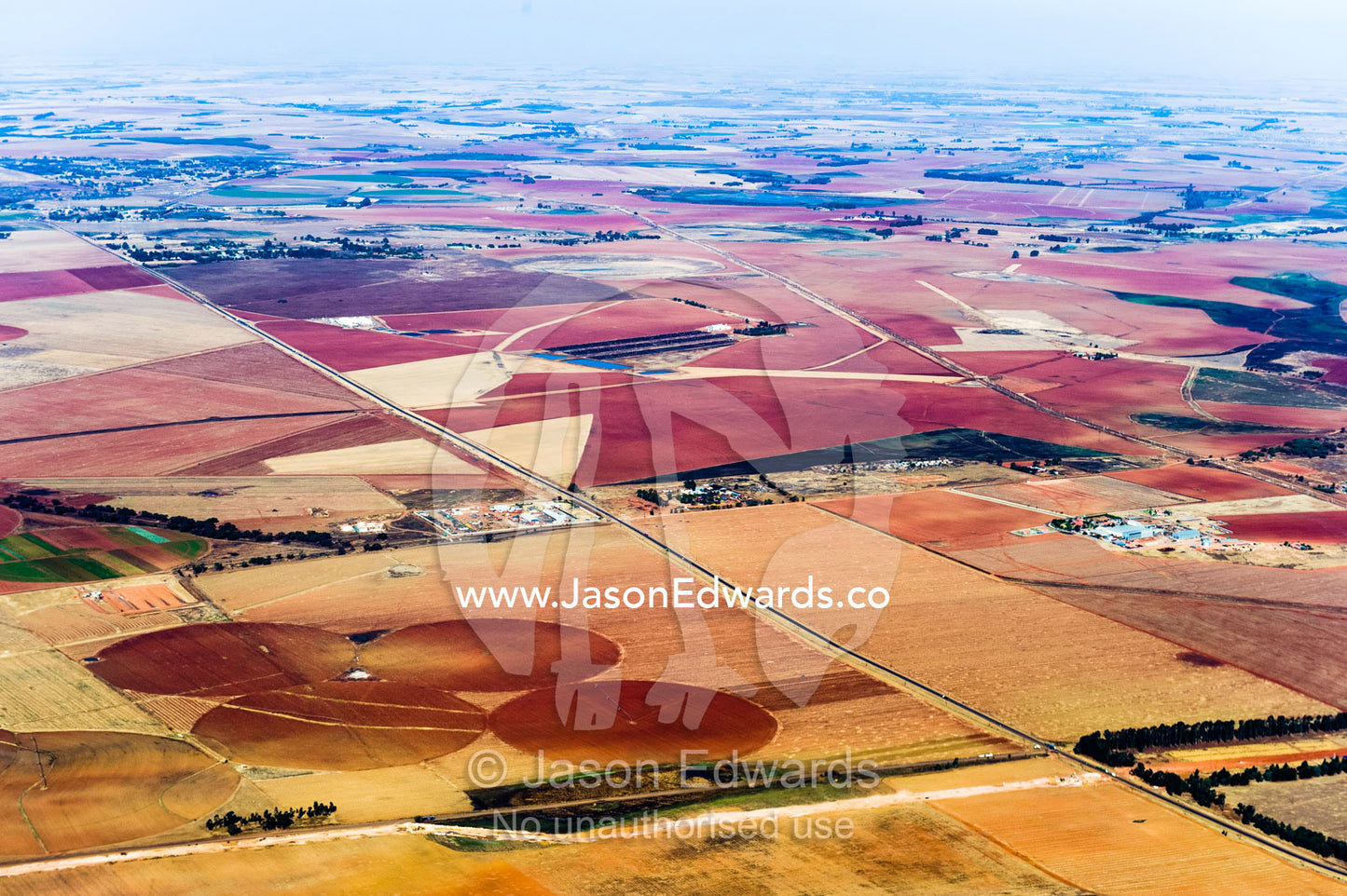 Dry and arid farmland surrounding agricultural crop circles. Johannesburg, Gauteng Province, South Africa, Africa.