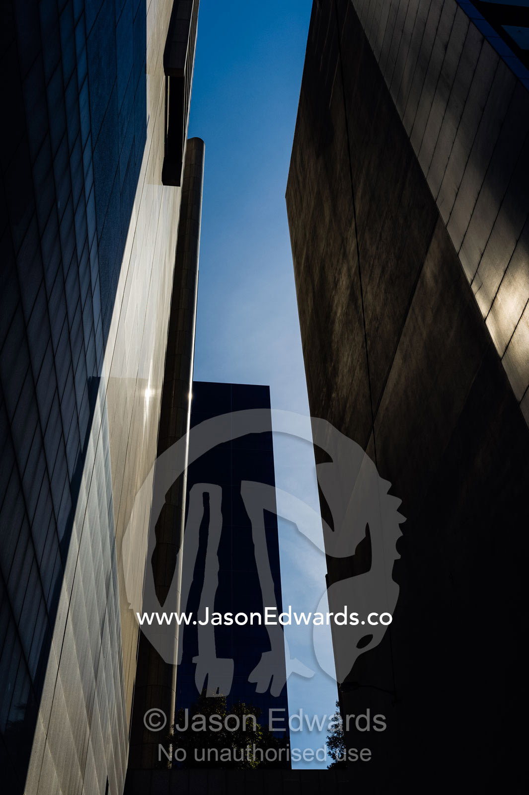 An alley between a pair of concrete and glass office towers in the CBD. Melbourne, Victoria, Australia.