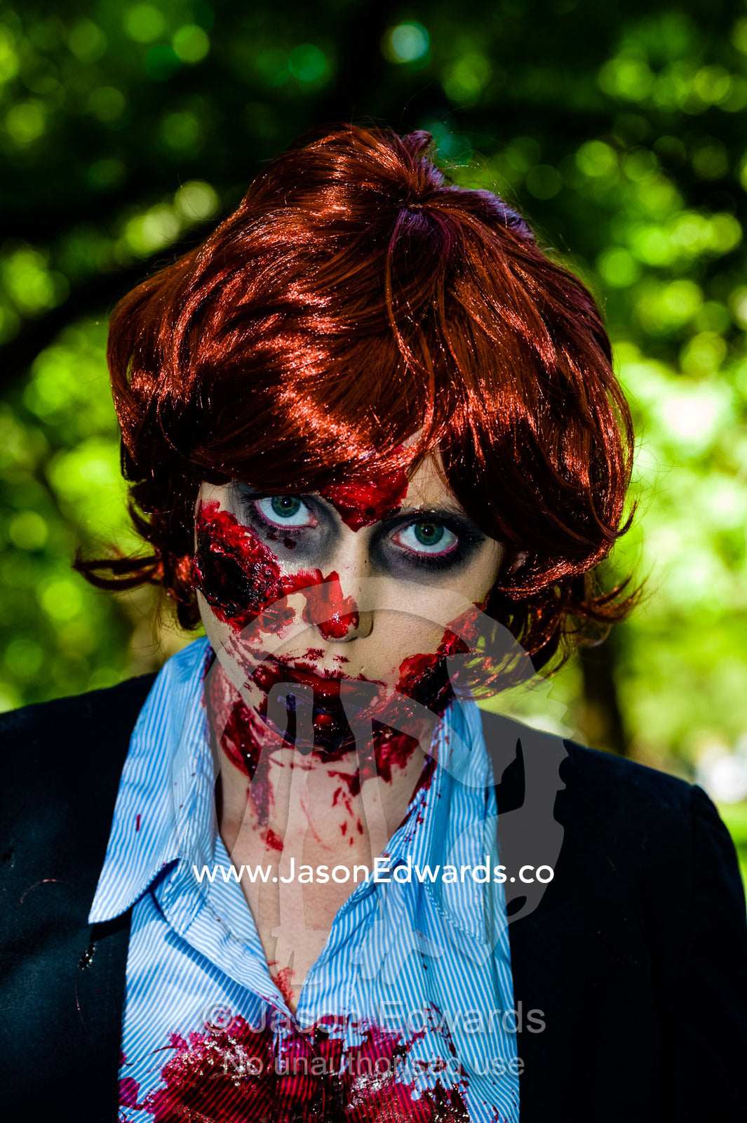 A woman dressed as a zombie Prime Minister Julia Gillard at a festival. Carlton Gardens, World Heritage Site, Carlton, Melbourne, Victoria, Australia.