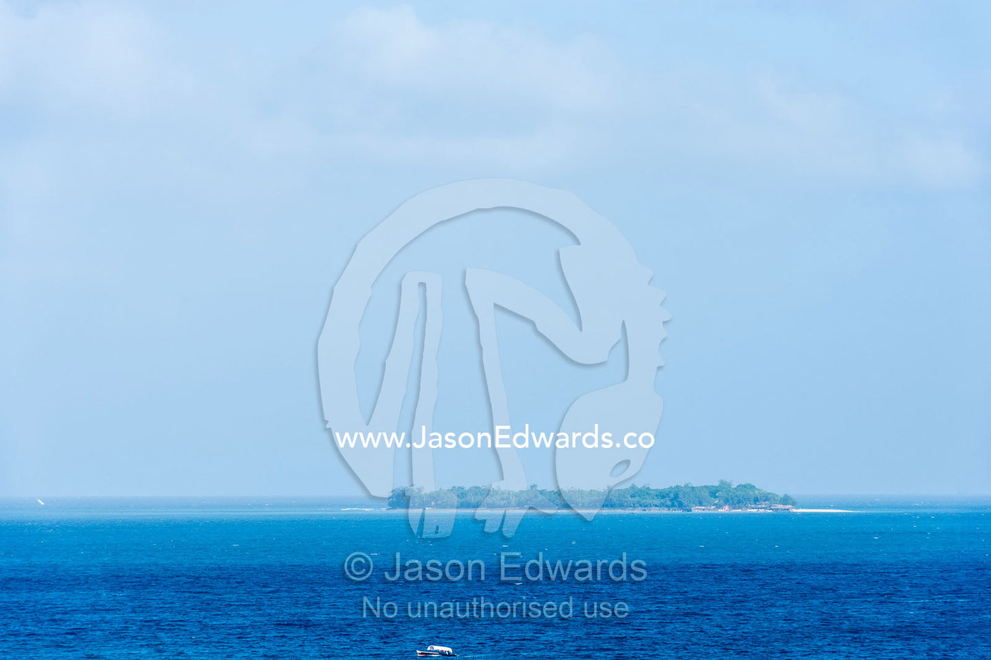 An offshore island surrounded by the blue waters of the Indian Ocean. Stone Town, Mji Mkongwe, Zanzibar, Unguja Island, Zanzibar, Tanzania.