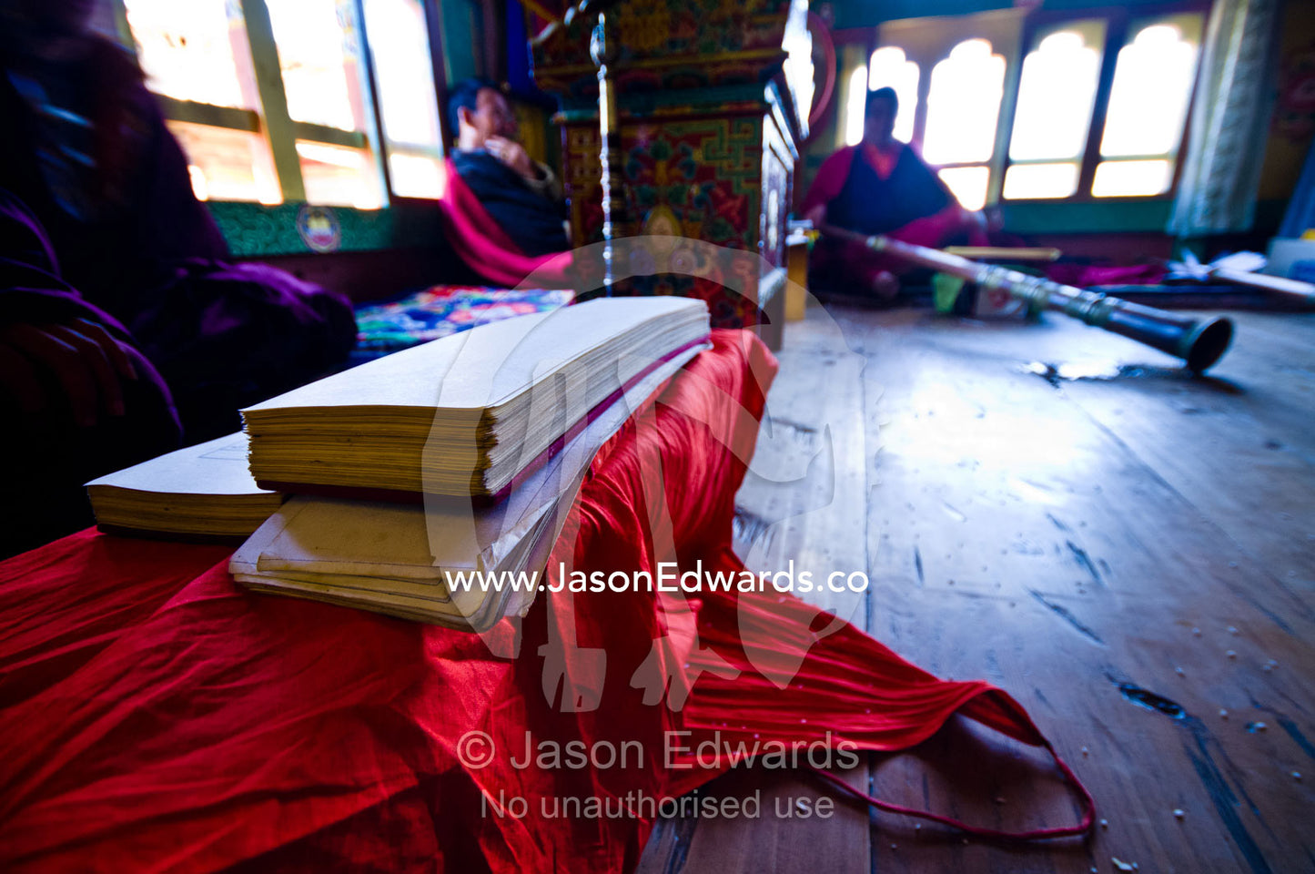 Piles of parchment covered in Sanskrit text played by Buddhist monks on dungchen horns at a death ceremony in a Bhutanese home. Ganteng, Wangdue Phodrang District, Phobjika Valley, Phobjikha Valley, Gangteng Valley, Black Mountains, Bhutan.