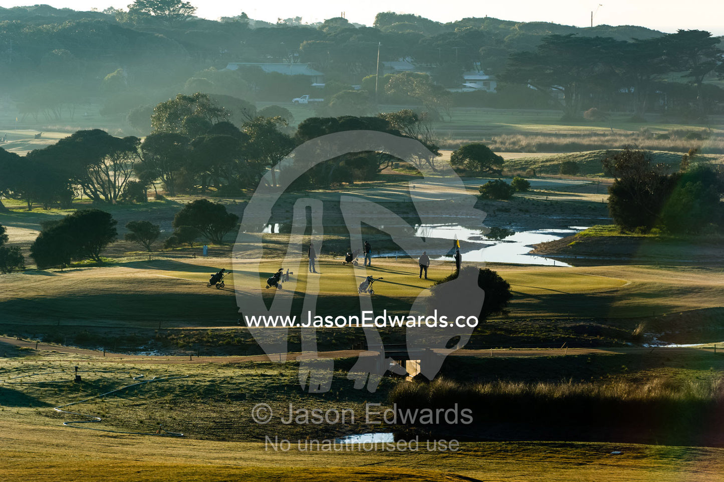 A bright sunny morning over the fairways and putting greens of a golf course by the ocean. RACV Torquay Resort, Torquay, Great Ocean Road, Surf Coast, Victoria, Australia.