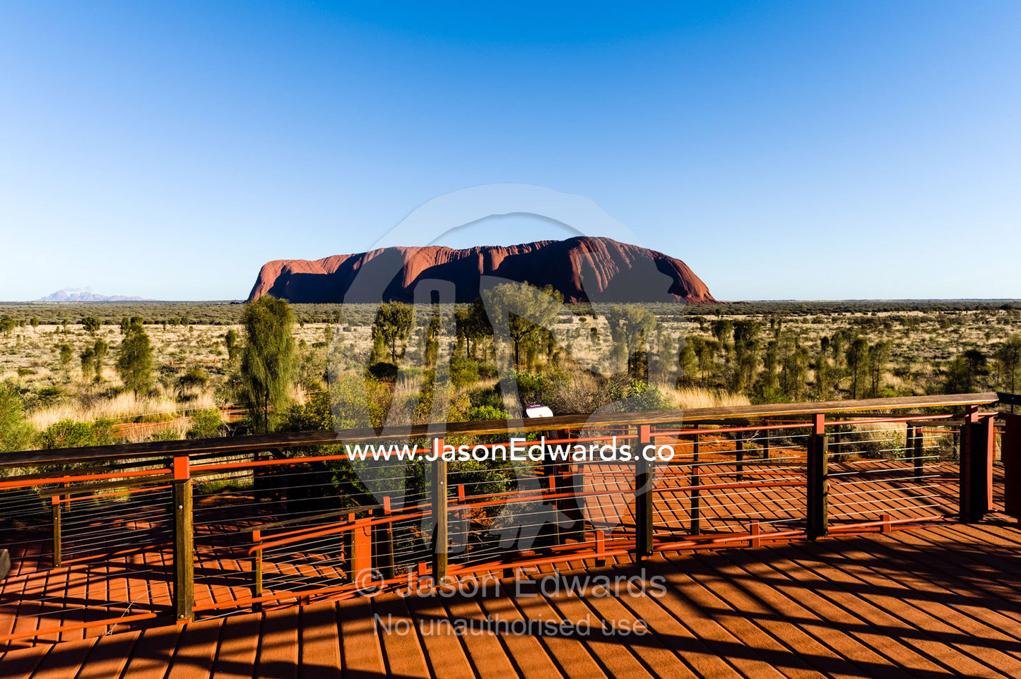 Viewing platforms give tourists an opportunity to see above the desert plain to Uluru. Uluru Kata Tjuta National Park, Northern Territory, Australia.