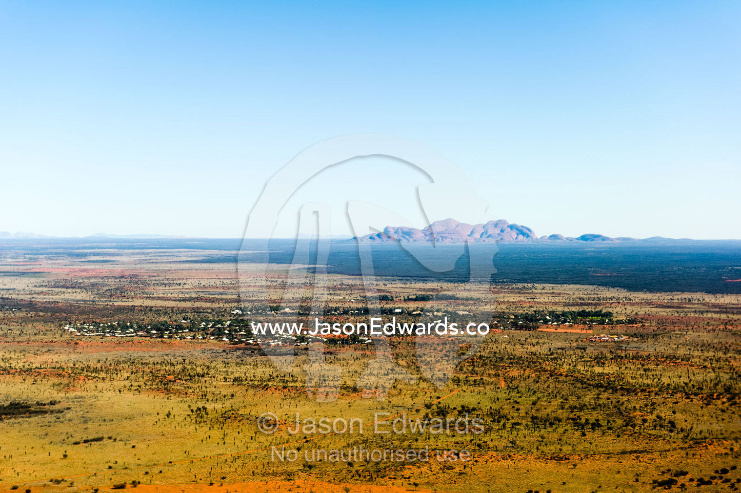 The ochre domes of Kata Tjuta rise from a vast desert plain in Australia's Outback. Uluru Kata Tjuta National Park, Northern Territory, Australia.