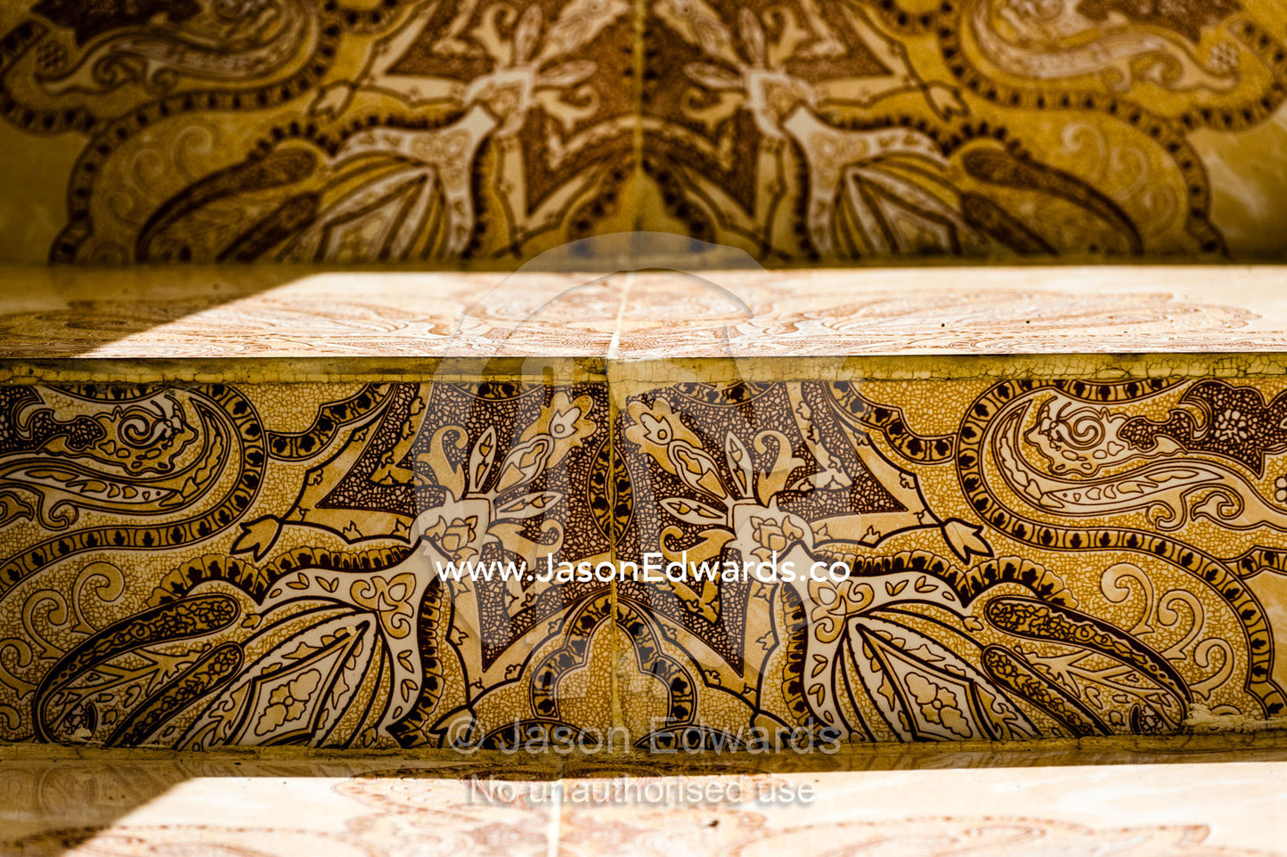 Ornate decorated tiles on the steps of a home in a mountain village. Mibam, Wadi Tiwi, Sur Al Sharqiyah South Governorate, Sultanate of Oman.