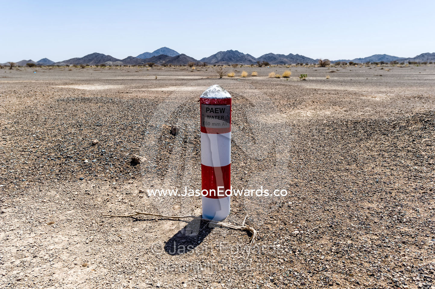 A well marker indicates where water is close to the desert surface in an aquaduct. Nizwa, Sultanate of Oman.