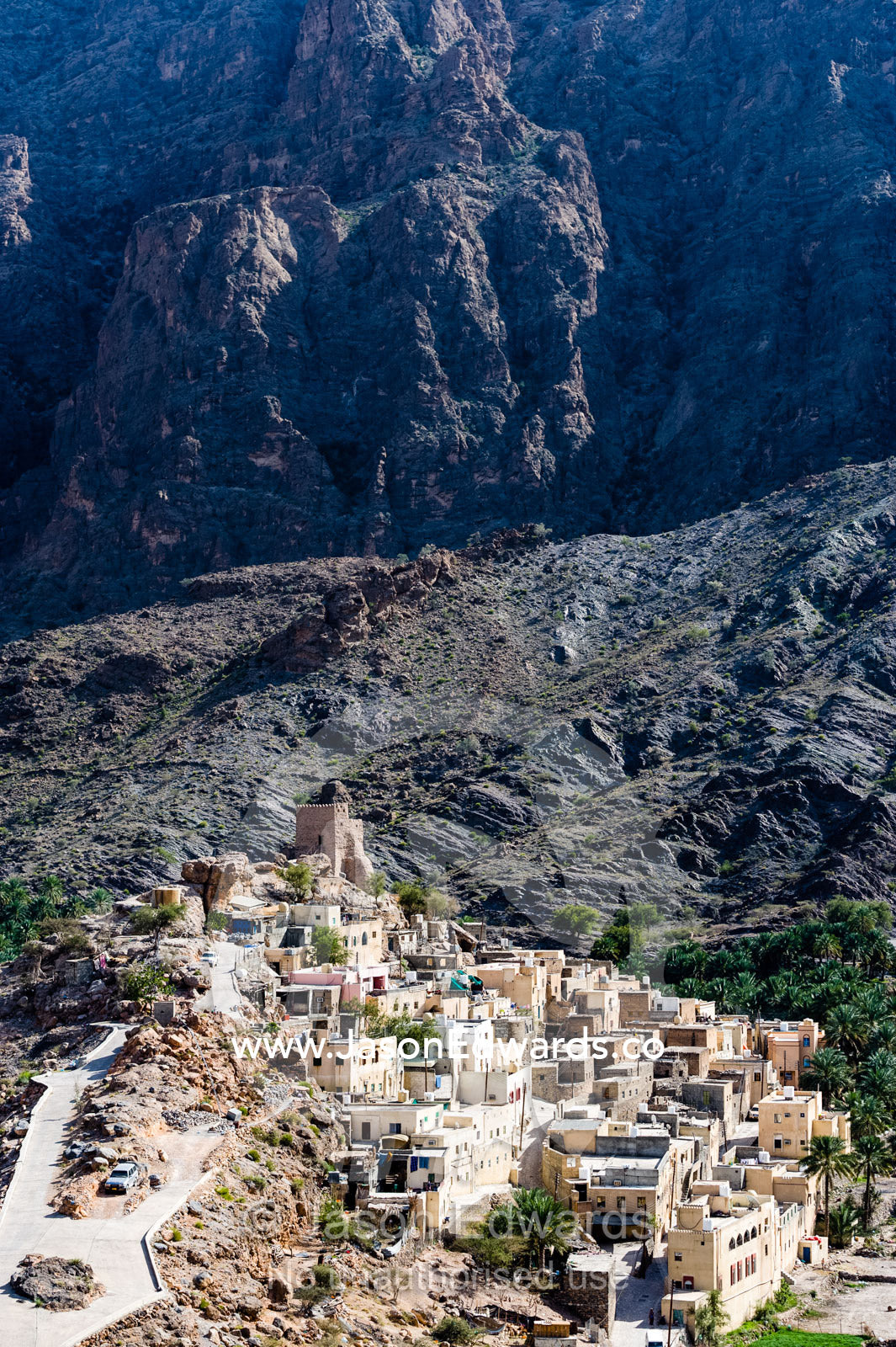 A mountain village stacked on terraced streets in a desert mountain valley. Balad Sayt, Wadi Bani Awf, Snake Gorge, Western Hajar Mountains, Ad Dakhiliyah Region, Sultanate of Oman.