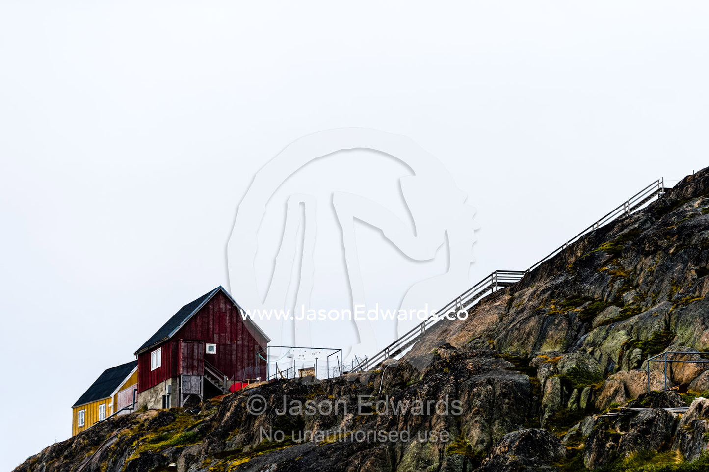 Flights of stairs connect homes on a rugged island community in the Arctic. Kangaamiut, Gammel Sukkertoppen, Qeqqata Municipality, Greenland.