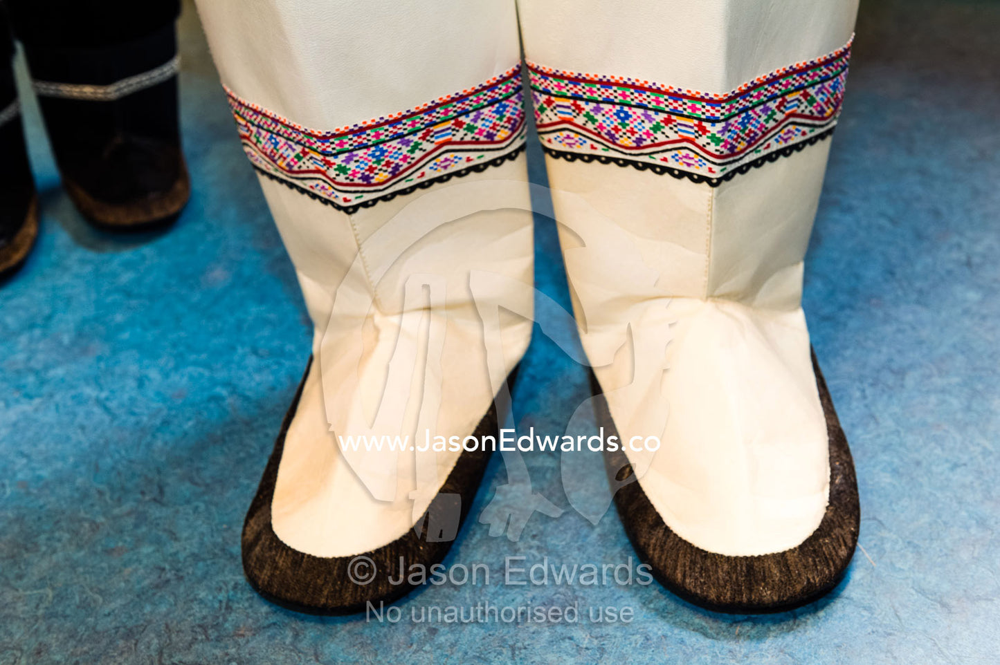 Mukluks or Kamik are a soft boot traditionally made of reindeer skin or sealskin and were originally worn by Arctic aboriginal people, including the Inuit and Yupik. Kangaamiut, Gammel Sukkertoppen, Qeqqata Municipality, Greenland.