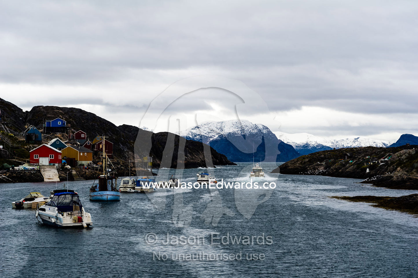 An arctic fishing community perched on a rugged, barren island. Kangaamiut, Gammel Sukkertoppen, Qeqqata Municipality, Greenland.