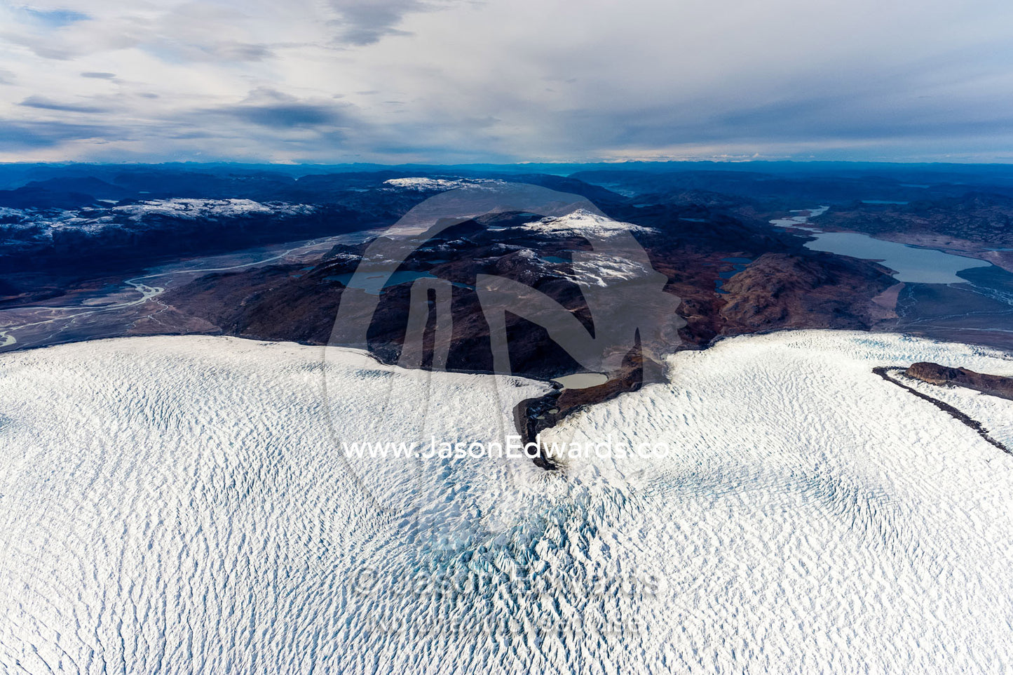 Pressure ridges in a glacier build up around an island in the Greenland Ice Sheet. Russell Glacier, Greenland Ice Sheet, Qeqqata Municipality, Kangerlussuaq, Greenland.