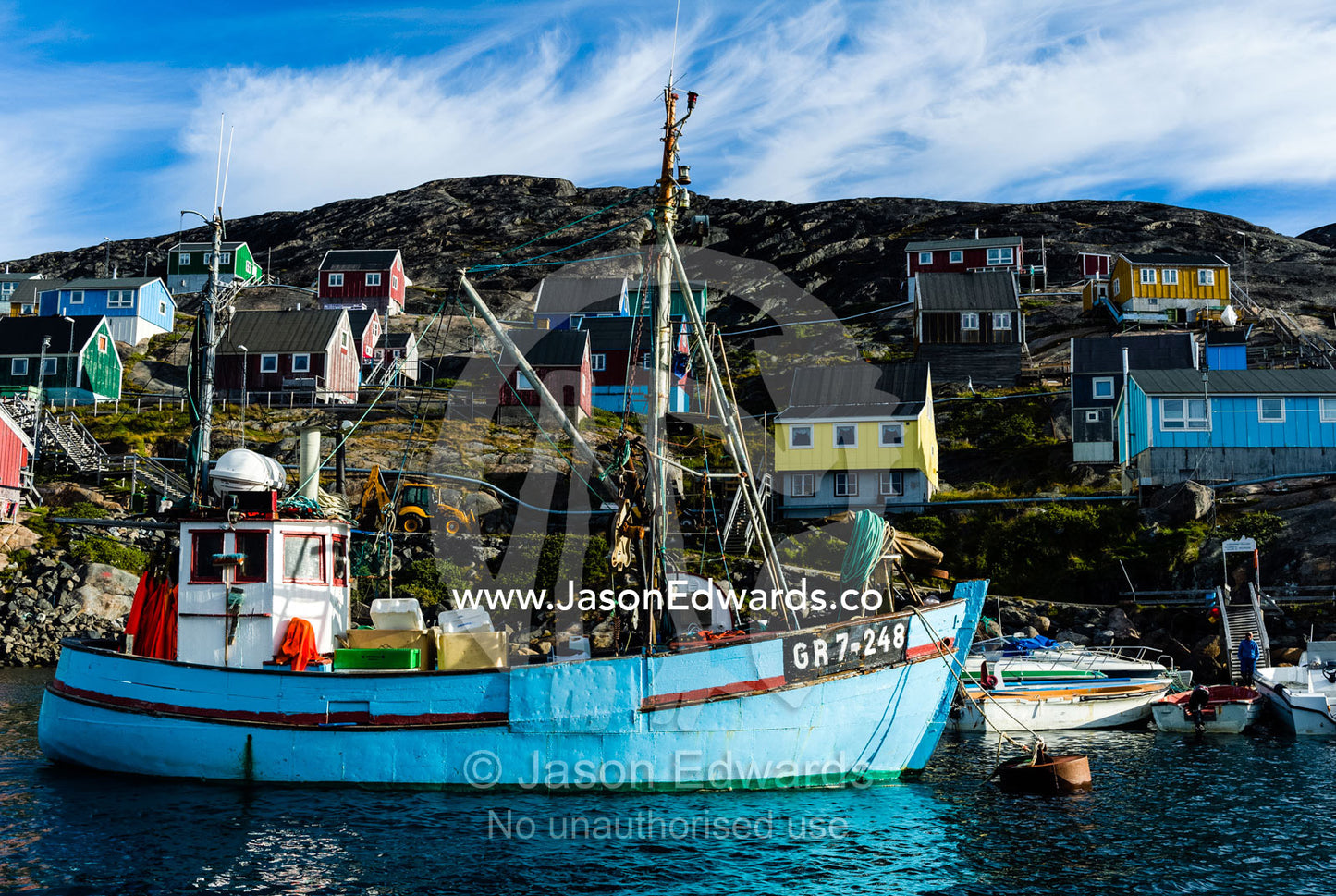 Fishing boats in the quiet harbor of a village on an arctic island. Kangaamiut, Gammel Sukkertoppen, Qeqqata Municipality, Greenland.