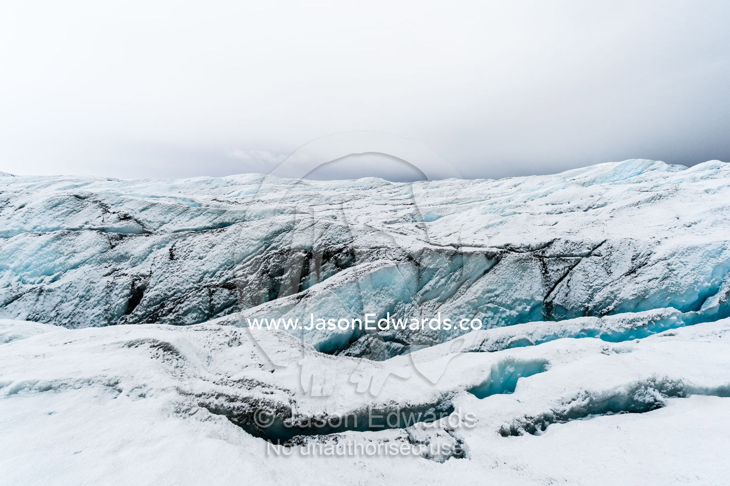 The frozen and barren wasteland of ice and crevasse on the surface of the Greenland Ice Sheet. Greenland Ice Sheet, Qeqqata Municipality, Kangerlussuaq, Greenland.