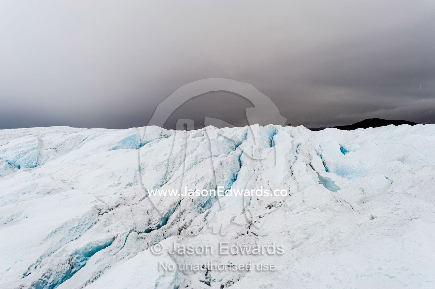 The frozen and barren wasteland of folded ice and crevasse on the surface of the Greenland Ice Sheet. Greenland Ice Sheet, Qeqqata Municipality, Kangerlussuaq, Greenland.