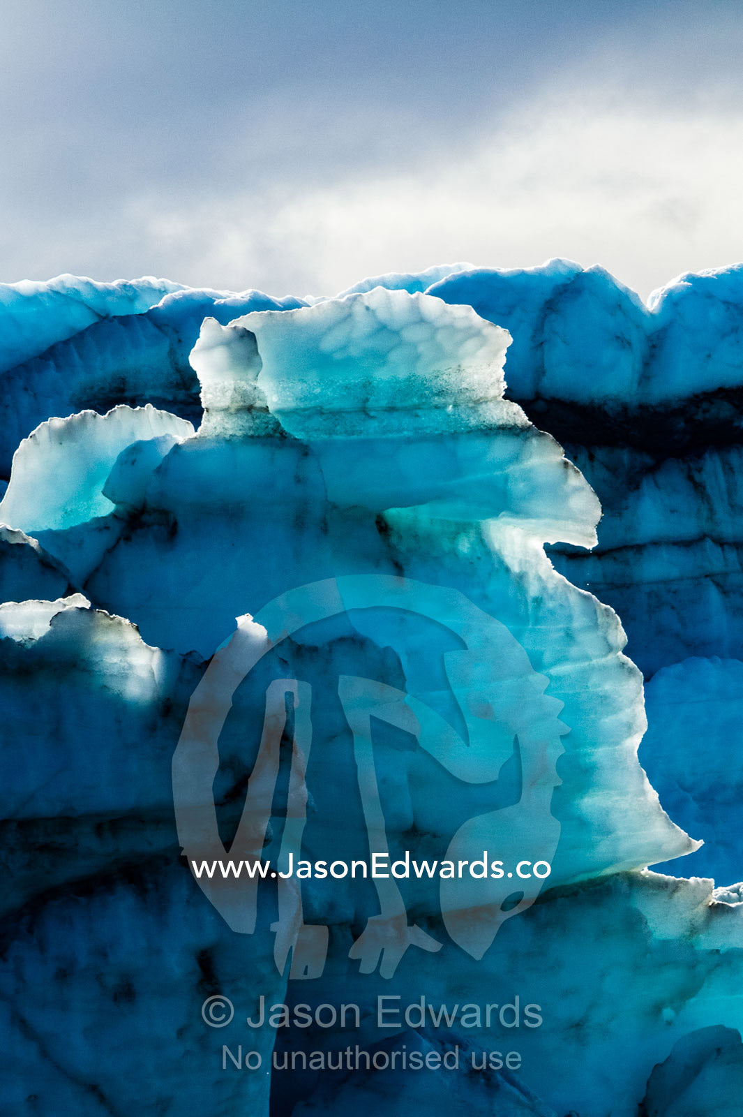 Treacherous jagged ice spires on a glacier fracture zone known as serac. Russell Glacier, Greenland Ice Sheet, Qeqqata Municipality, Kangerlussuaq, Greenland.