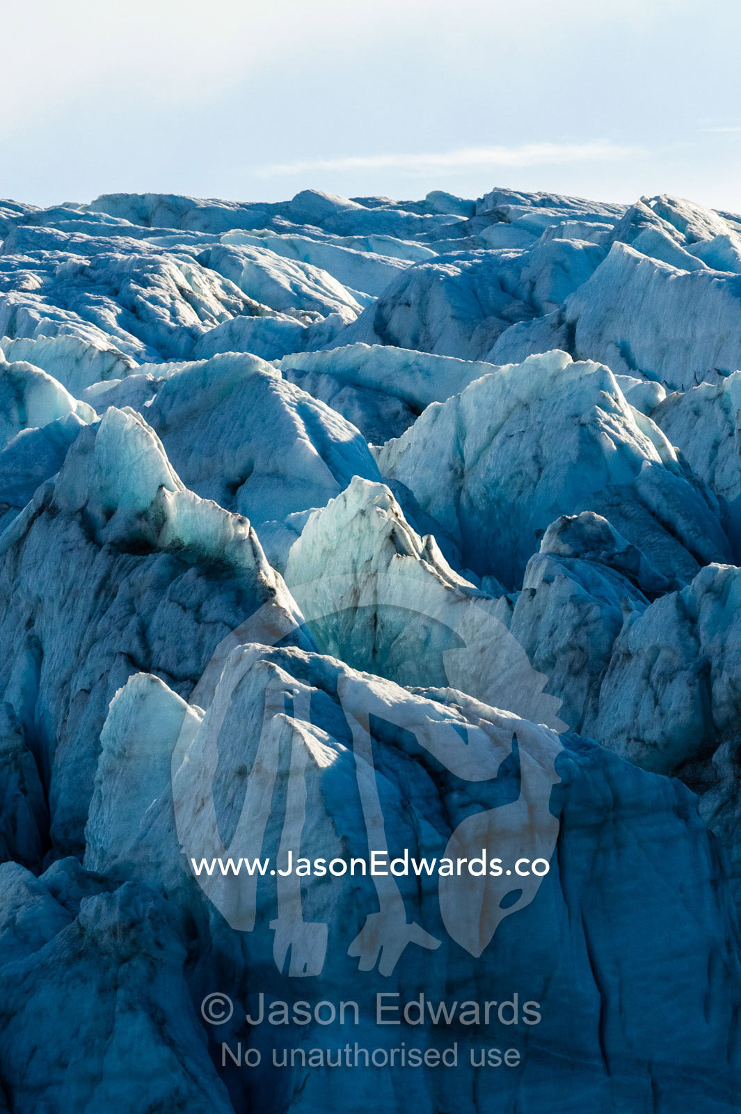 Treacherous jagged ice spires on a glacier fracture zone known as serac. Russell Glacier, Greenland Ice Sheet, Qeqqata Municipality, Kangerlussuaq, Greenland.