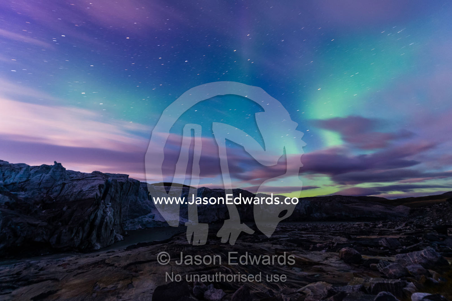 Iridescent green northern lights dance in the sky above Russell Glacier. Russell Glacier, Greenland Ice Sheet, Qeqqata Municipality, Kangerlussuaq, Greenland.
