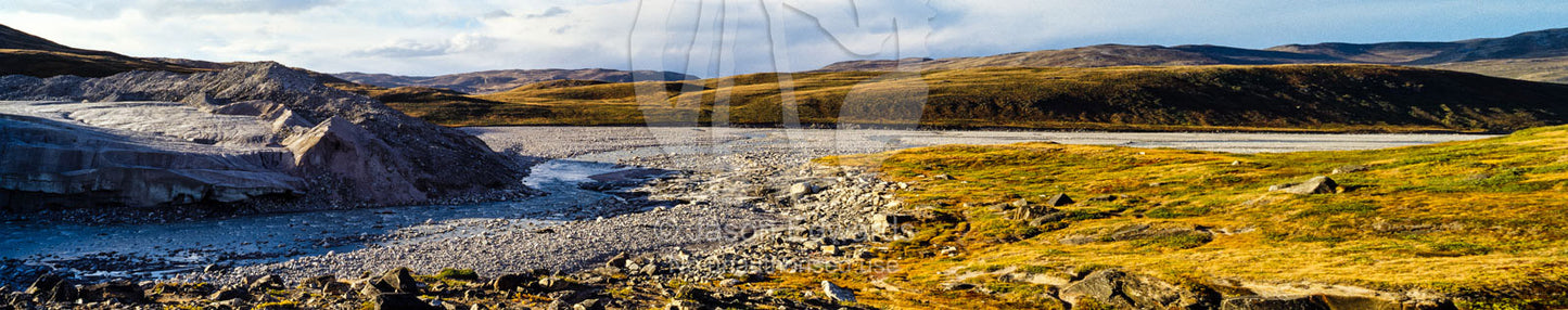 A river flowing along the fracture zone of an enormous glacier across a tundra plain. Qinnguata Kuussua River, Russell Glacier, Greenland Ice Sheet, Qeqqata Municipality, Kangerlussuaq, Greenland.