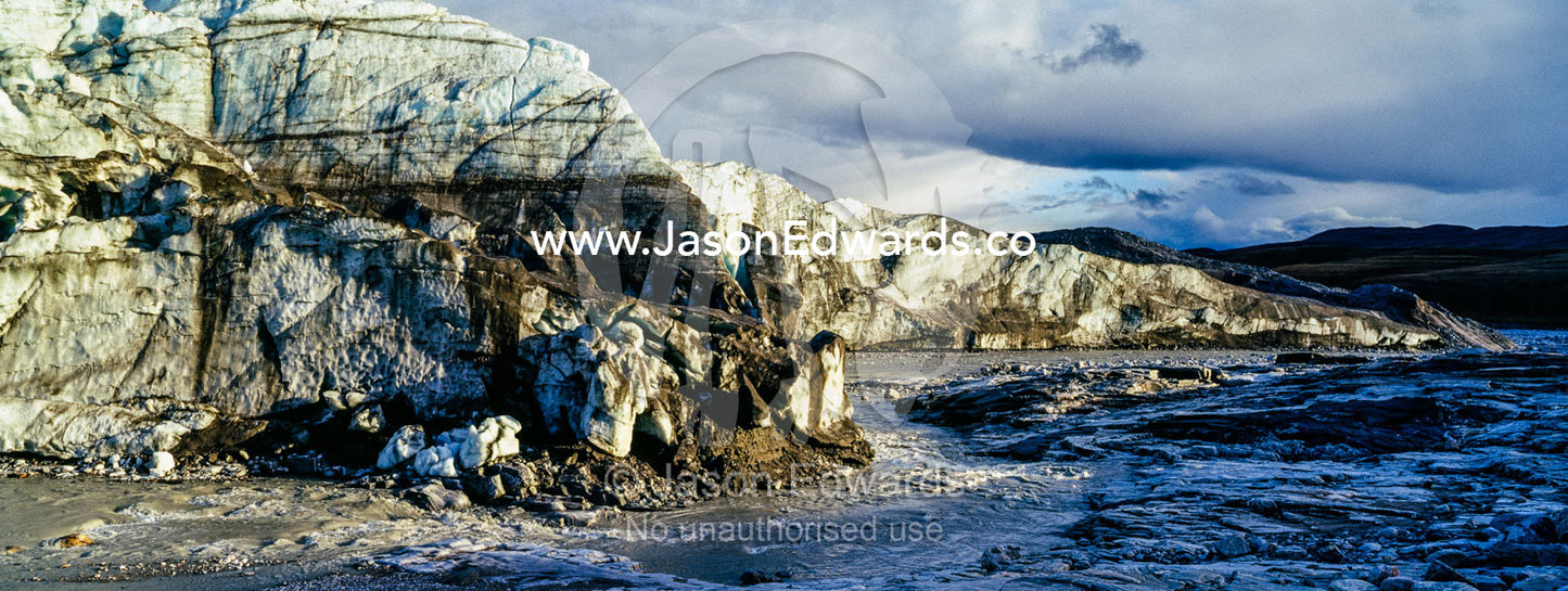 A river flowing along the fracture zone of an enormous glacier. Russell Glacier, Greenland Ice Sheet, Qeqqata Municipality, Kangerlussuaq, Greenland.