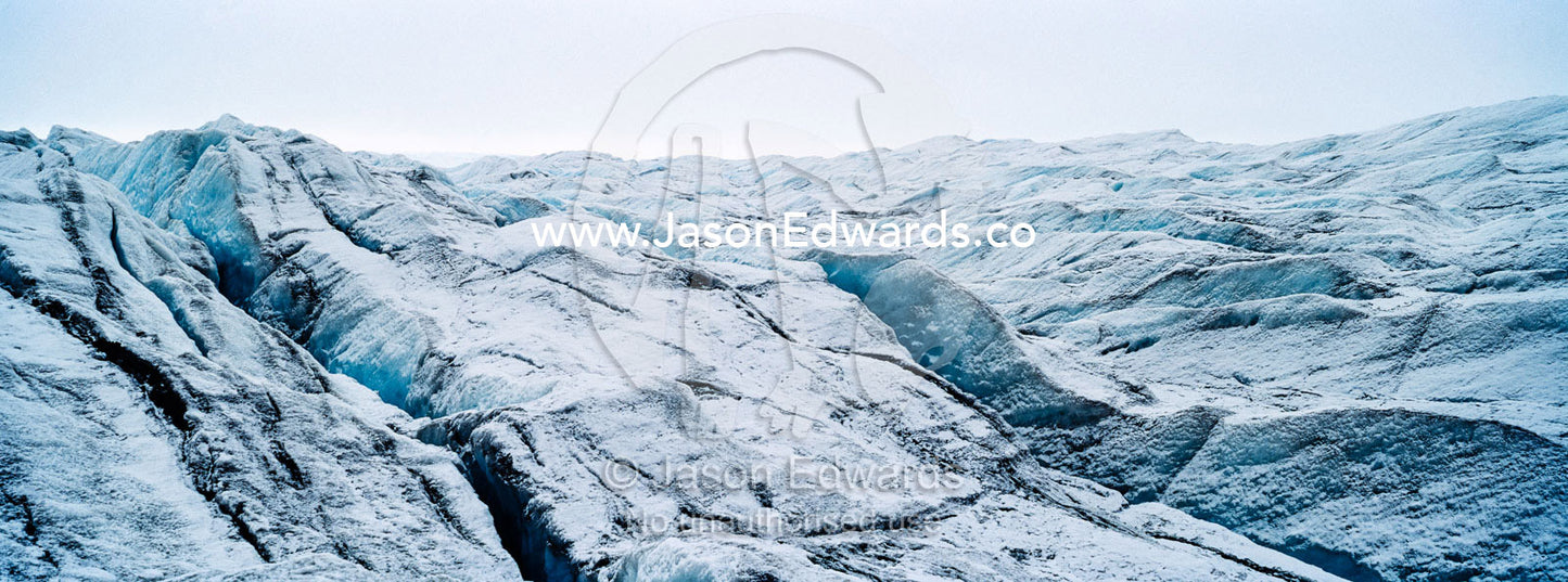 The frozen and barren wasteland of folded ice and crevasse on the surface of the Greenland Ice Sheet. Greenland Ice Sheet, Qeqqata Municipality, Kangerlussuaq, Greenland.