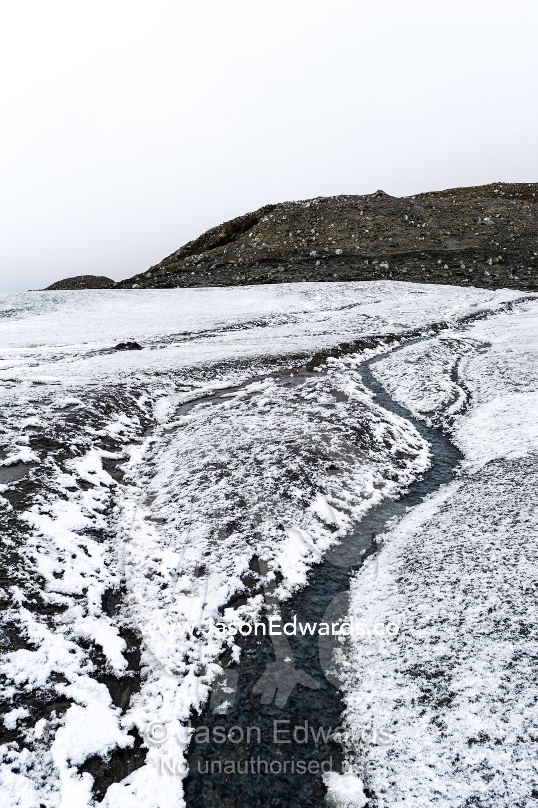 A meltwater stream flowing down from the Greenland Ice Sheet. Isunngua Highland, Greenland Ice Sheet, Kangerlussuaq, Qeqqata Municipality, Greenland.