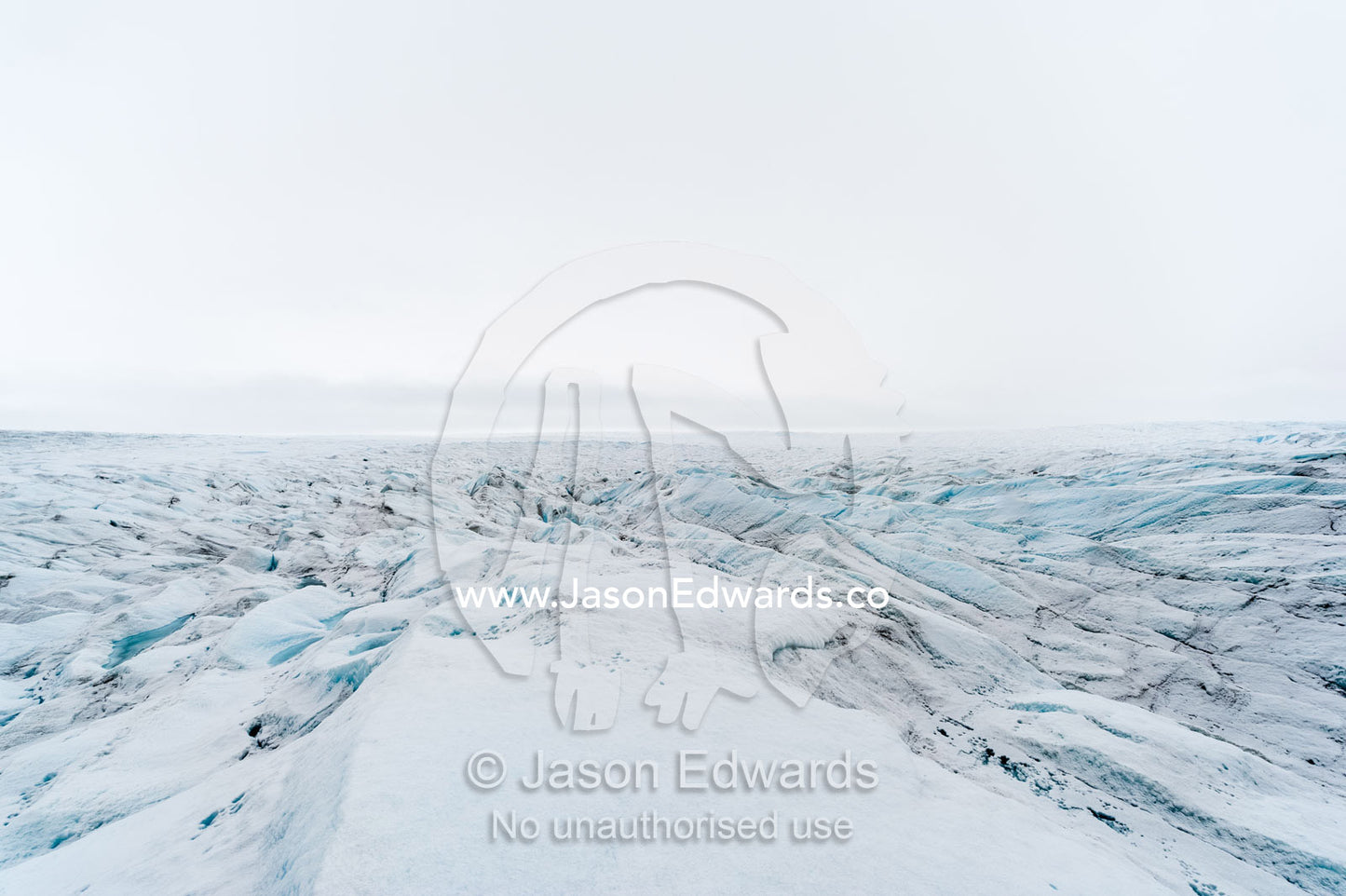 The frozen and barren wasteland of folded ice on the surface of the Greenland Ice Sheet. Greenland Ice Sheet, Qeqqata Municipality, Kangerlussuaq, Greenland.