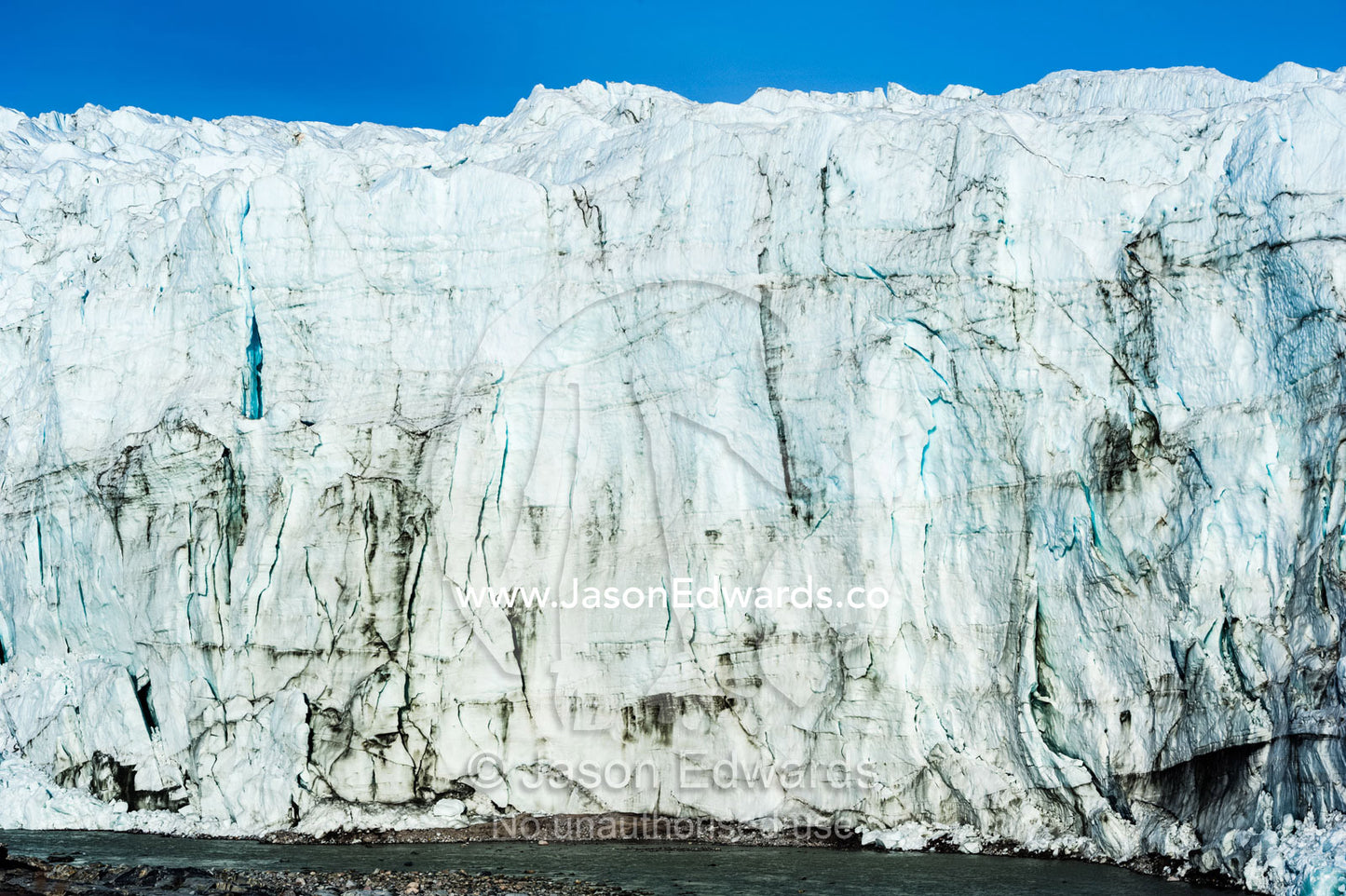 The sheer ice cliff of a glacier fracture zone. Russell Glacier, Greenland Ice Sheet, Qeqqata Municipality, Kangerlussuaq, Greenland.