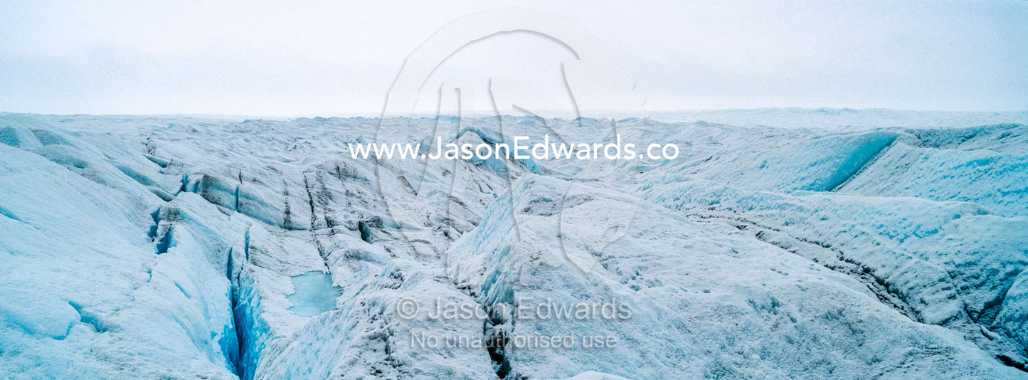 The frozen and barren wasteland of ice and crevasse on the surface of the Greenland Ice Sheet. Greenland Ice Sheet, Qeqqata Municipality, Kangerlussuaq, Greenland.