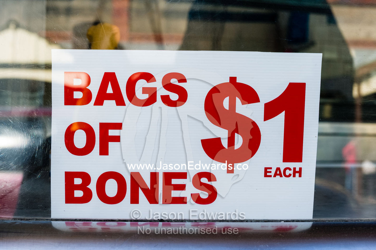 A sign advertising bones for sale in a butcher shop. Maldon, Shire of Mount Alexander, Victoria, Australia.