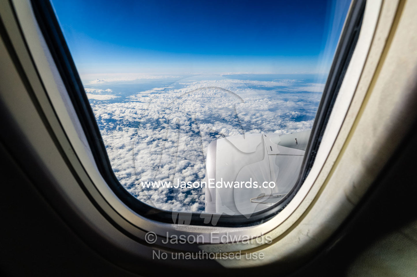 The jet engine of a passenger plane viewed through a window. Sydney, New South Wales, Australia.