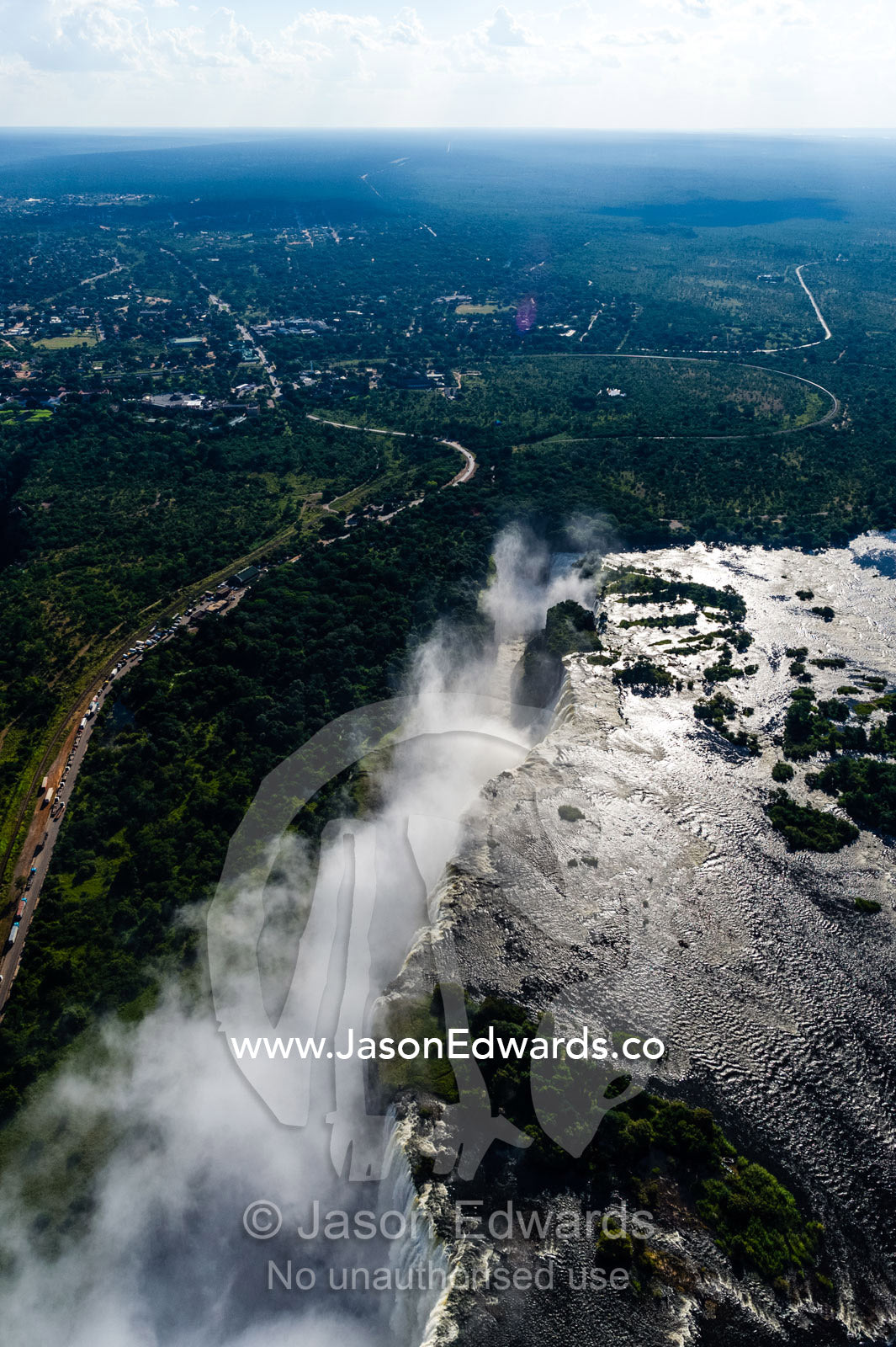 Torrents of water from the Zambezi River cascade over Victoria Falls into the chasm at First Gorge. Zambezi River, Victoria Falls, Mosi-oa-Tunya National Park, Zambia.