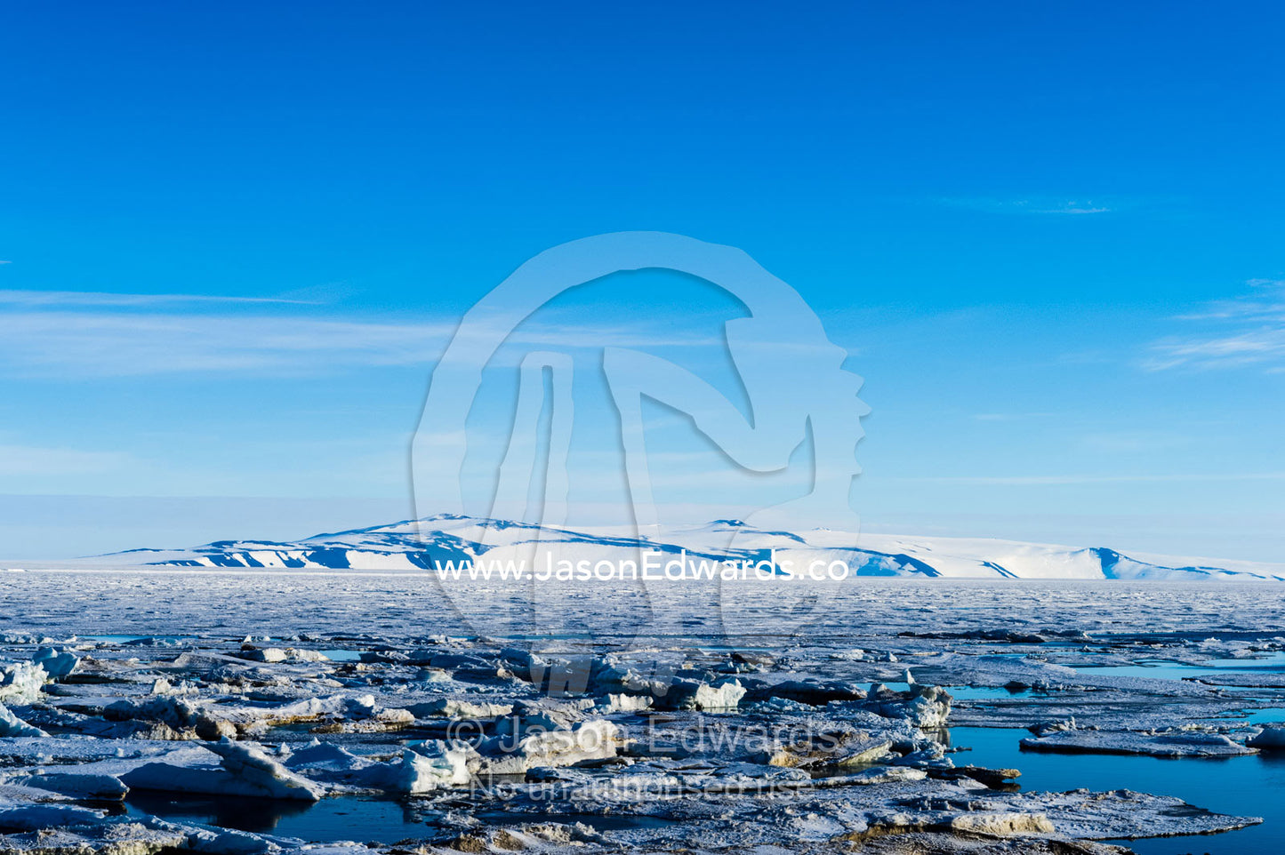 Ocean melt ponds expand where the Antarctic sea ice is melting in summer. Haskell Strait, McMurdo Sound, Ross Island, Antarctica