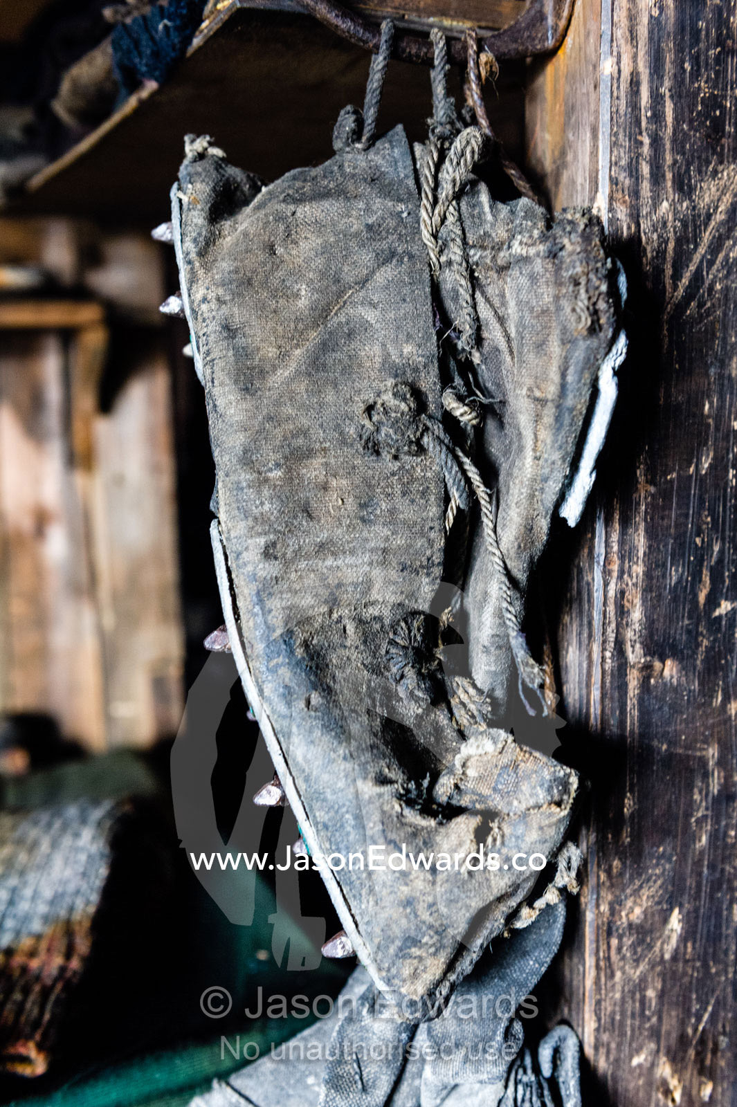 A leather boot hangs by its laces in the hut of Antarctic explorer Robert Falcon Scott. Scott's Hut, Cape Evans, Ross Island, Antarctica