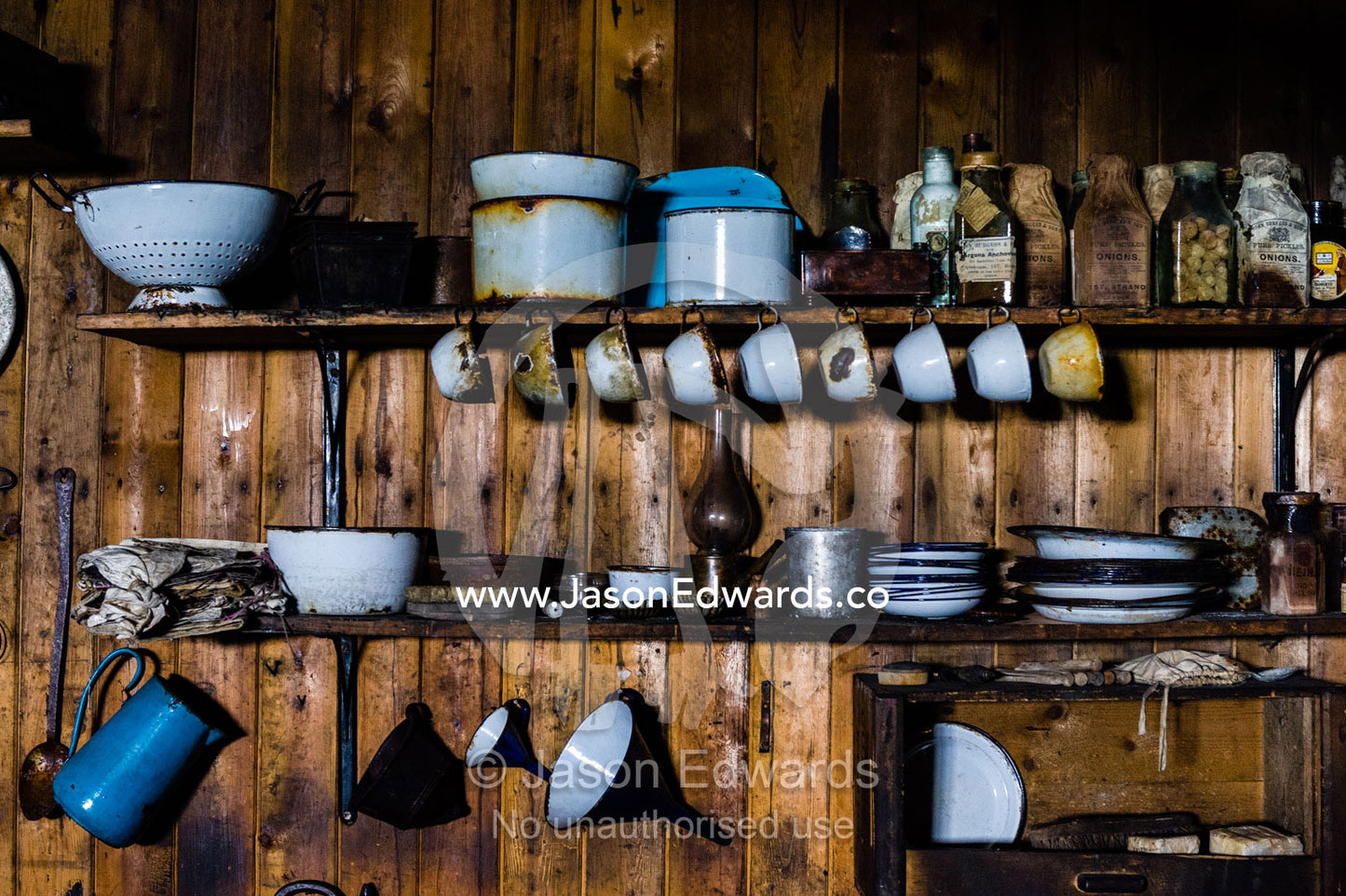 Plates, cups and kitchen utensils in the hut of Antarctic explorer Robert Falcon Scott. Scott's Hut, Cape Evans, Ross Island, Antarctica.