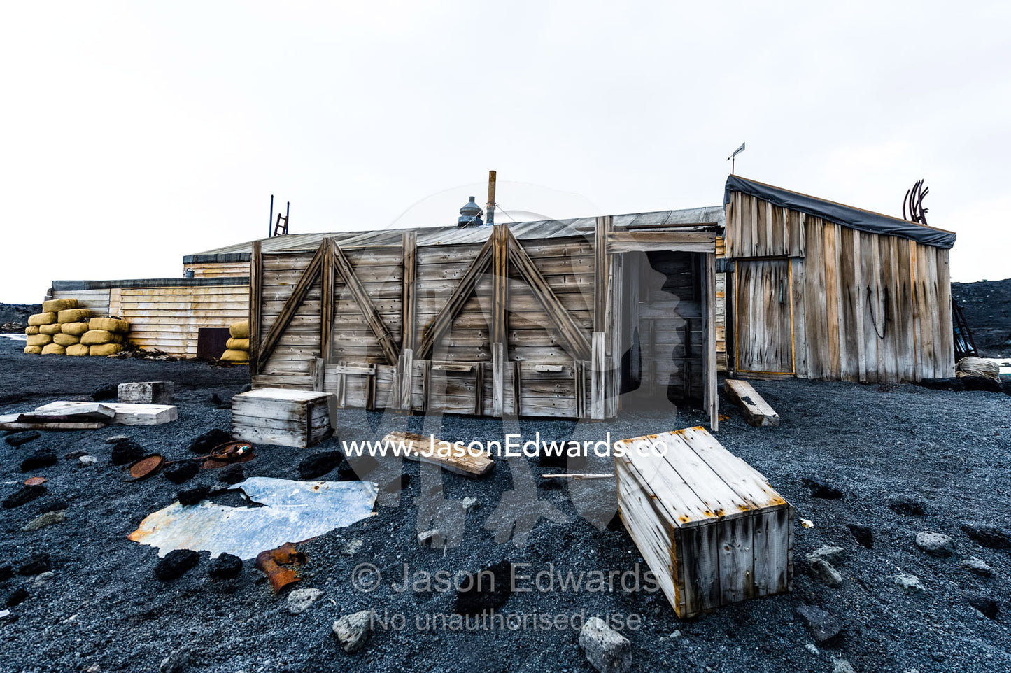 The weathered walls and supply boxes of the Antarctic explorer Robert Falcon Scott's hut. Scott's Hut, Cape Evans, Ross Island, Antarctica.