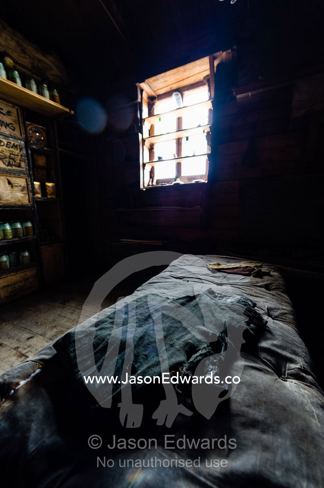 A pair of pants rests on a bed bunk in Antarctic explorer Ernest Shackleton's hut. Shackleton's Hut, Cape Royds, Ross Island, Antarctica.