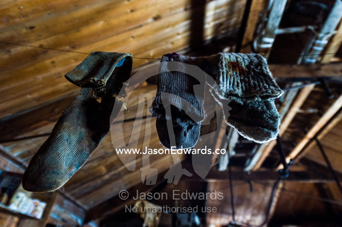 Woolen socks hanging from a clothes line in Antarctic explorer Ernest Shackelton's hut. Shackleton's Hut, Cape Royds, Ross Island, Antarctica.