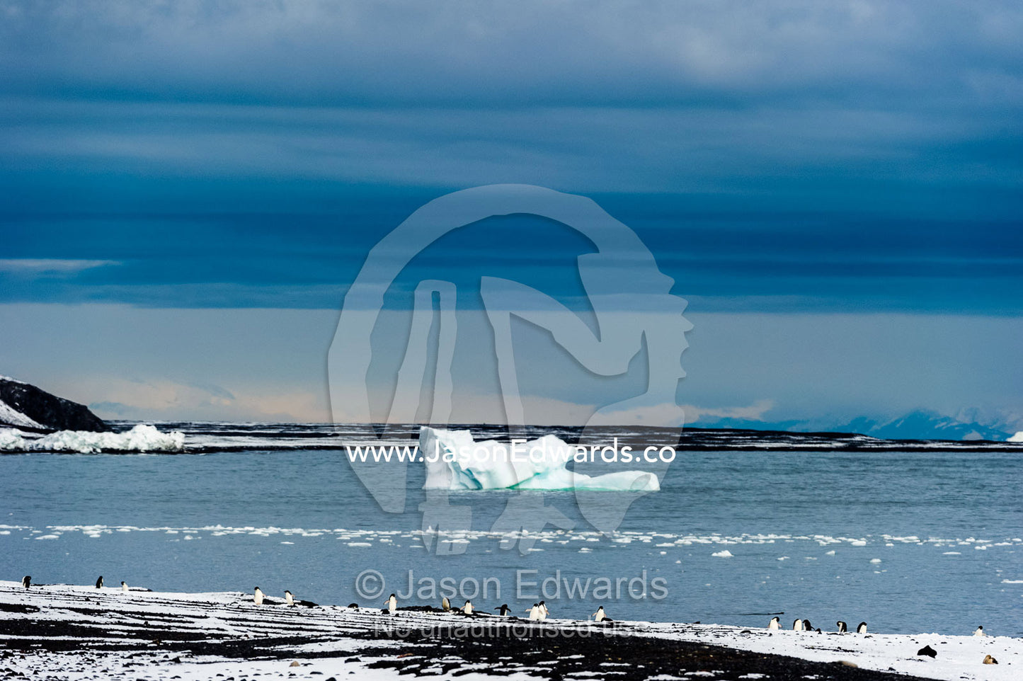An iceberg grounded near the shore of an island in Antarctica. Caughley Beach, Cape Bird, Ross Island, Antarctica.